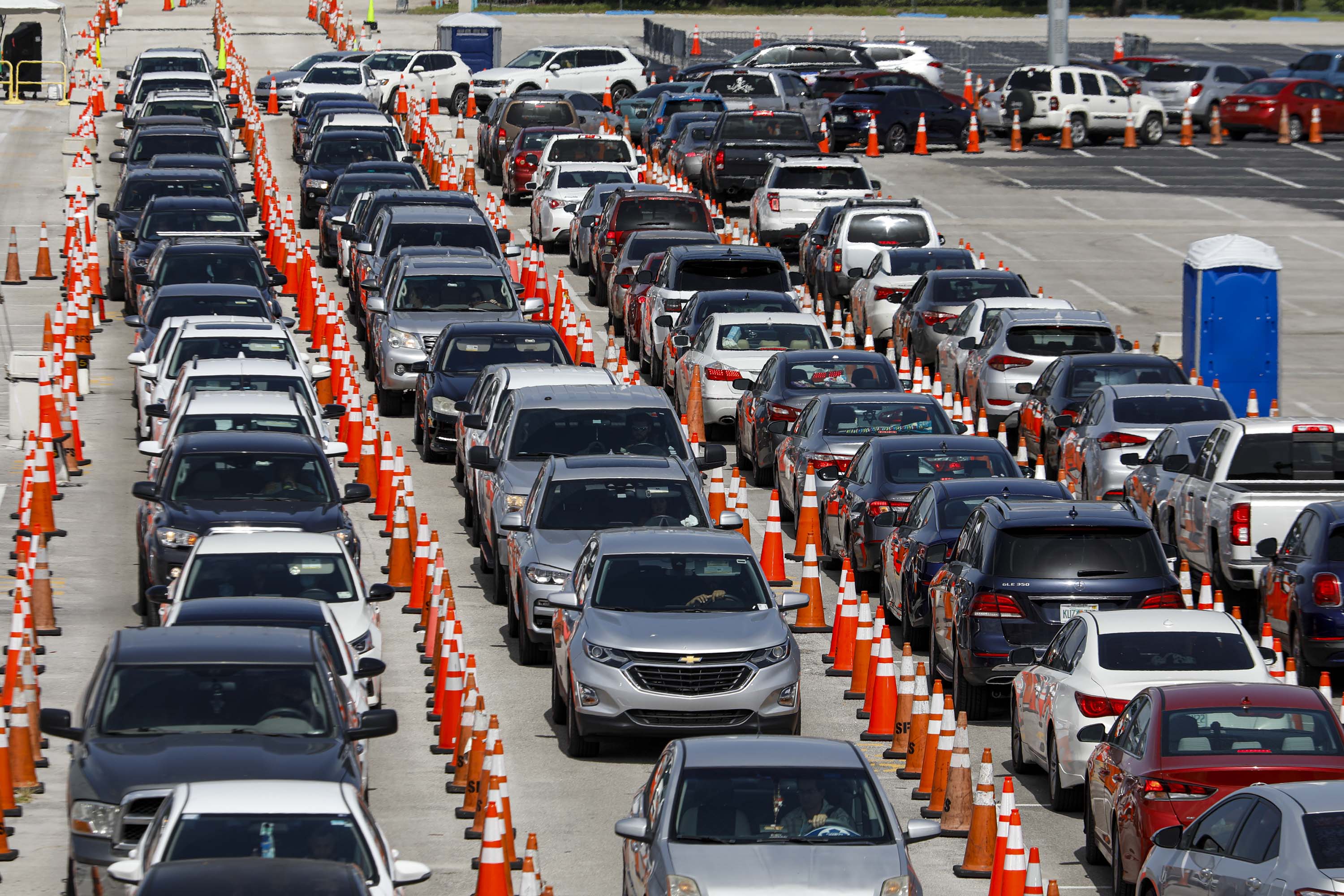 People in their vehicles wait to enter a Covid-19 drive-thru testing site at Hard Rock Stadium in Miami Gardens, Florida, on June 30.