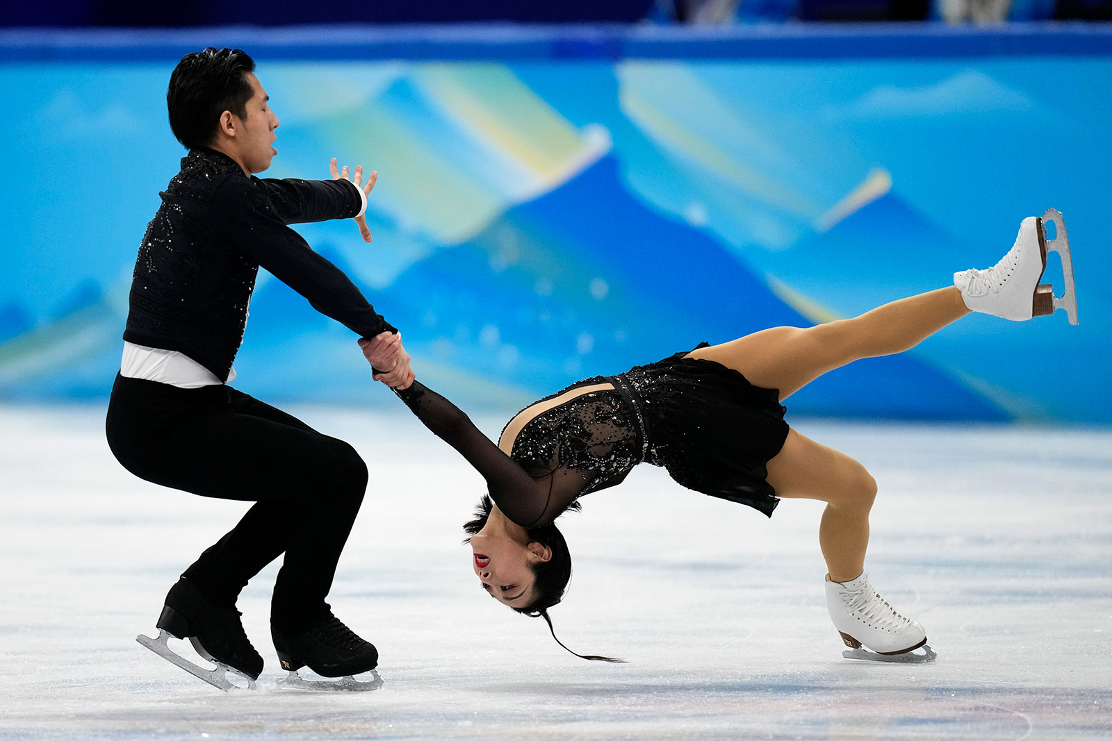 Chinese skating duo Sui Wenjing and Han Cong compete in the pairs short program on February 18.
