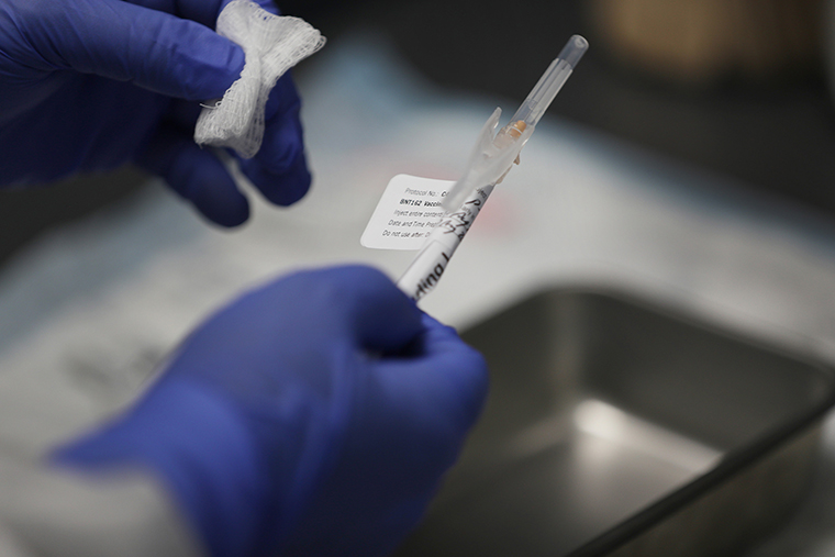 A COVID-19 vaccination is prepared at Research Centers of America on August 07, 2020 in Hollywood, Florida. Research Centers of America is currently conducting COVID-19 vaccine trials, implemented under the federal government's Operation Warp Speed program. 
