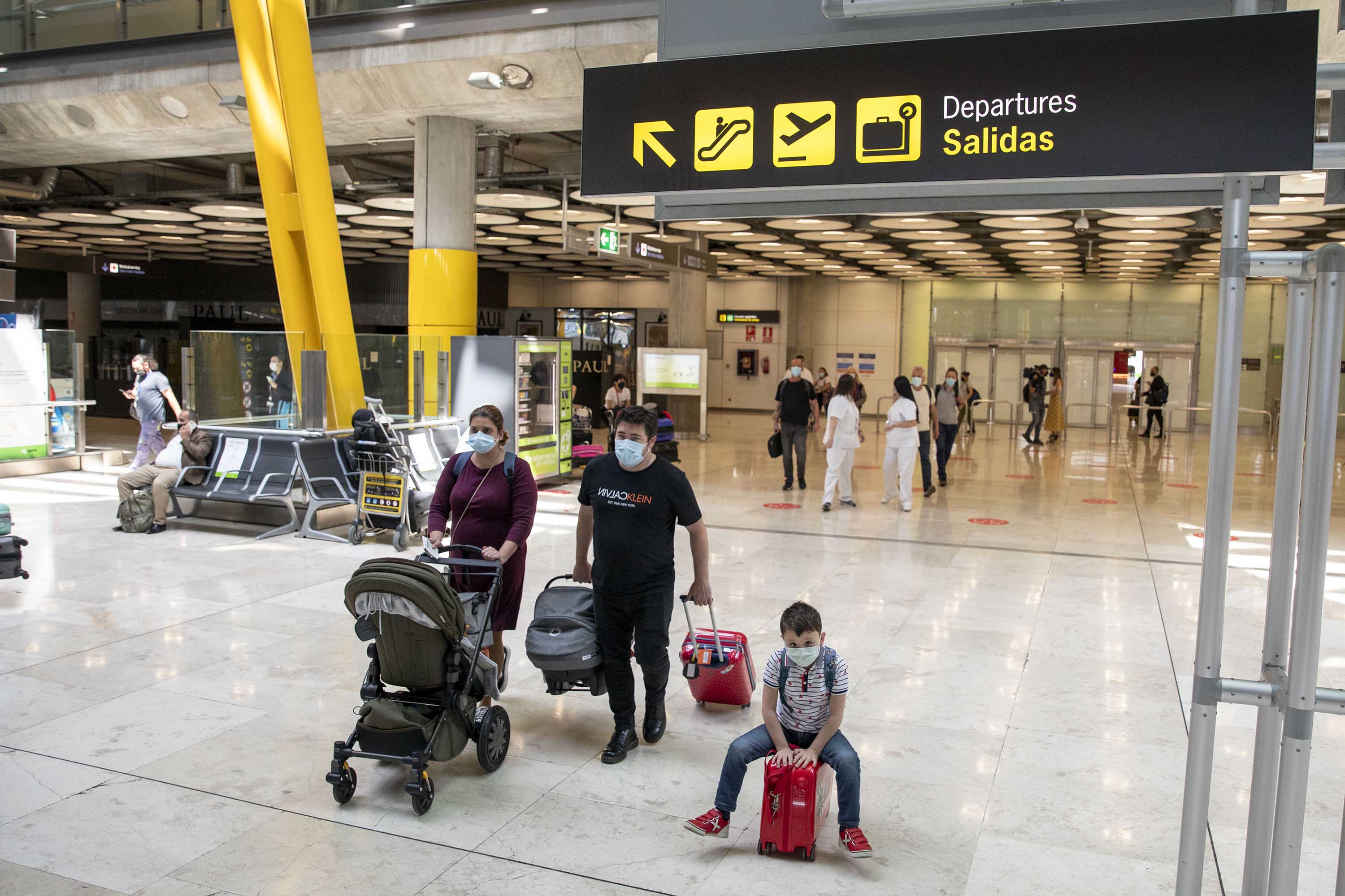 Travellers arrive at Adolfo Suárez Madrid-Barajas airport on June 7, in Madrid, Spain. 