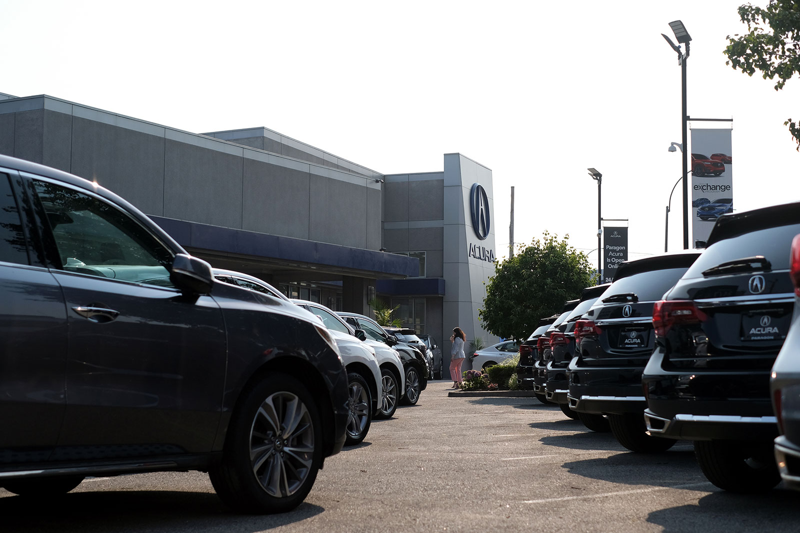 Cars sit in a lot at an Acura dealership in Queens, New York, on July 15.