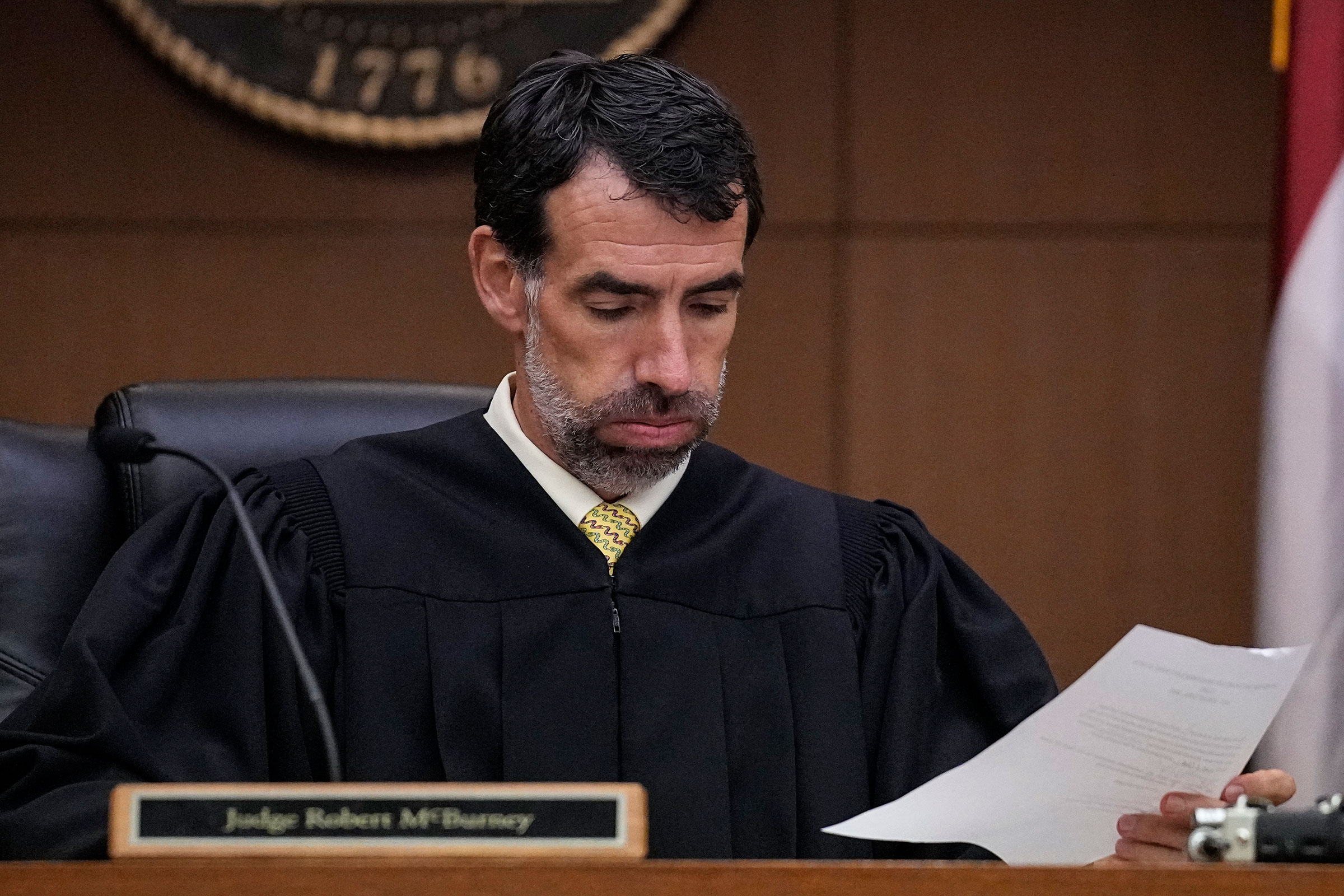 Fulton County Superior Court Judge Robert McBurney looks through paperwork, Monday, Aug. 14, 2023, in Atlanta. 