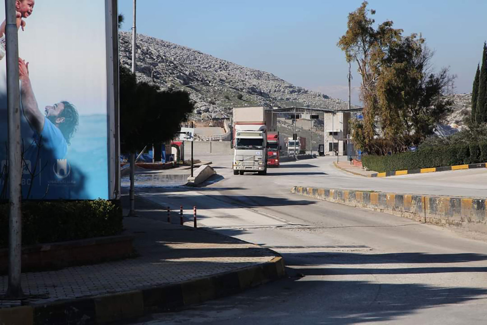 A truck from the first UN aid convoy to enter northwest Syria since Monday's earthquake crosses from Turkey into the region.
