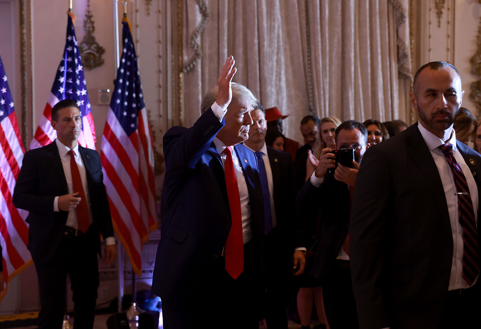 Former President Donald Trump waves after speaking during an event at his Mar-a-Largo home on November 15 in Palm Beach, Florida. 