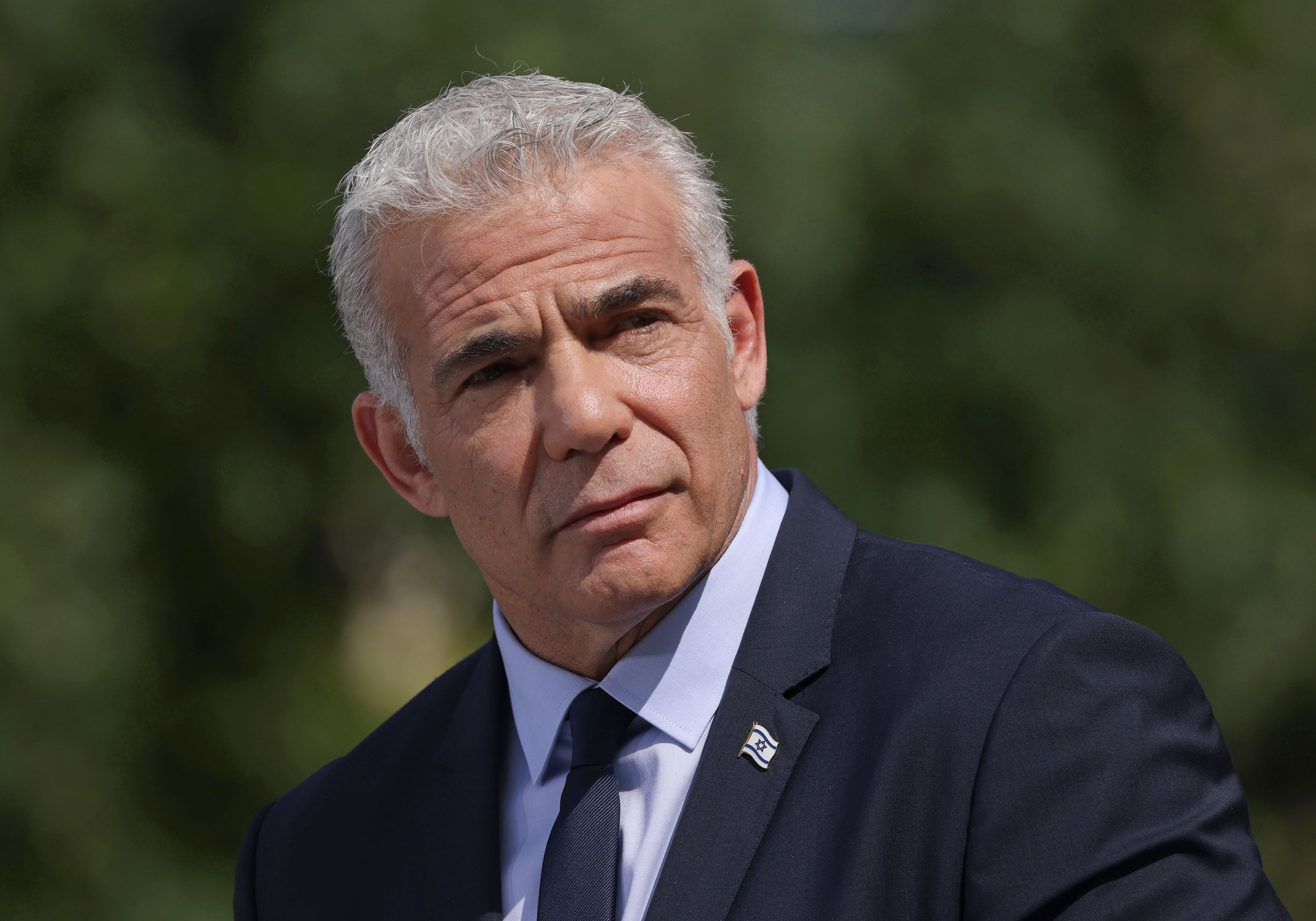 Yair Lapid speaks to the media after meeting with German Chancellor Olaf Scholz in Berlin on September 12, 2022. 