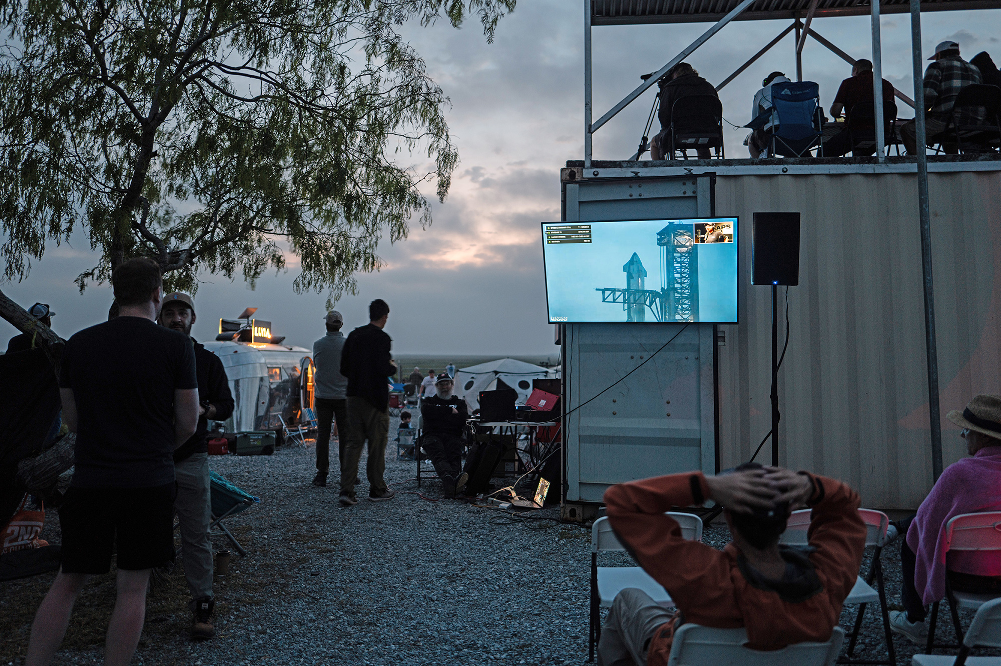 People wait together at Rocket Ranch for the launch of the SpaceX spacecraft in Brownsville, Texas, on March 14.