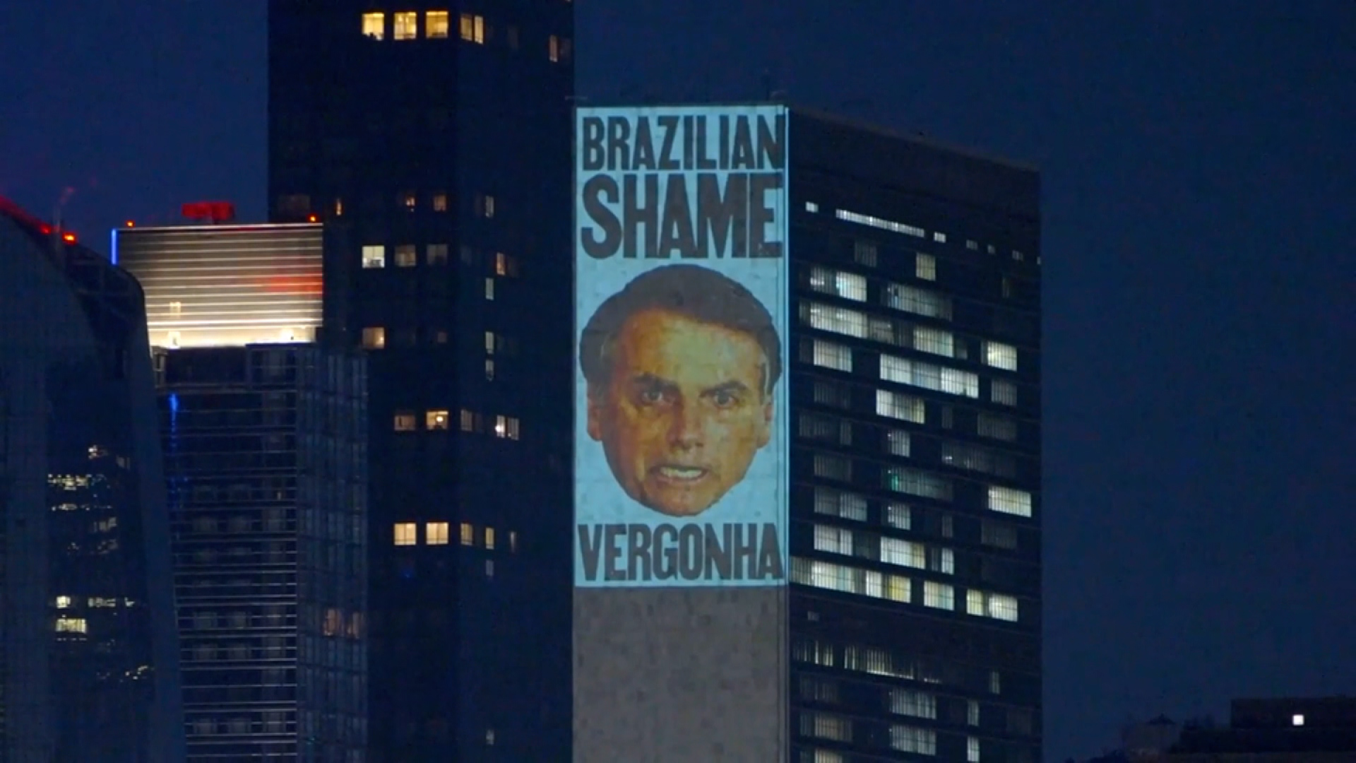 Anti-Bolsonaro activists project an image of the Brazilian president on the side of the United Nations building in New York City.