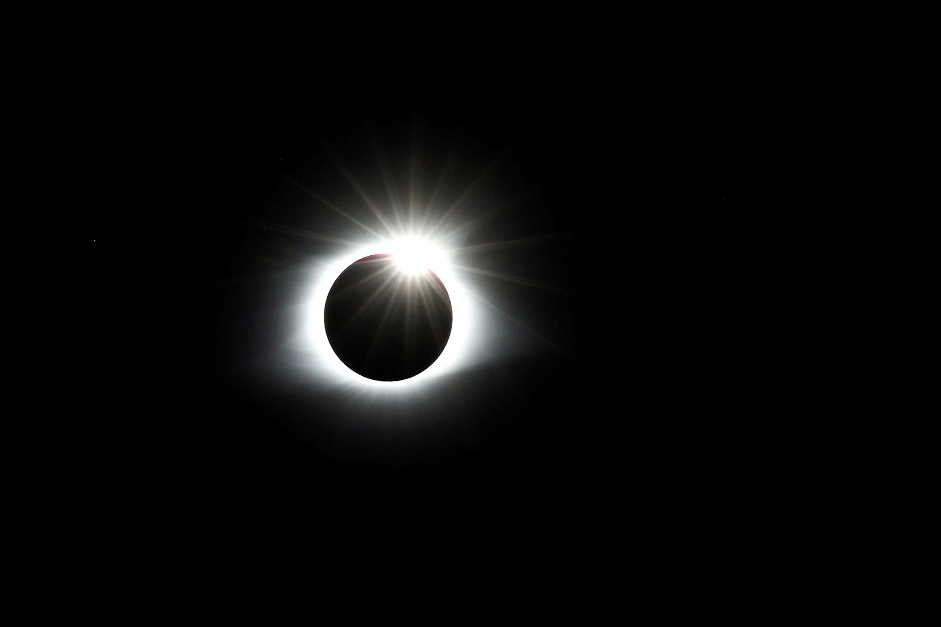 The solar eclipse creates the effect of a diamond ring during the solar eclipse on August 21, 2017, as seen from Clingmans Dome, which at 6,643 feet (2,025 meters) is the highest point in the Great Smoky Mountains National Park in Tennessee.