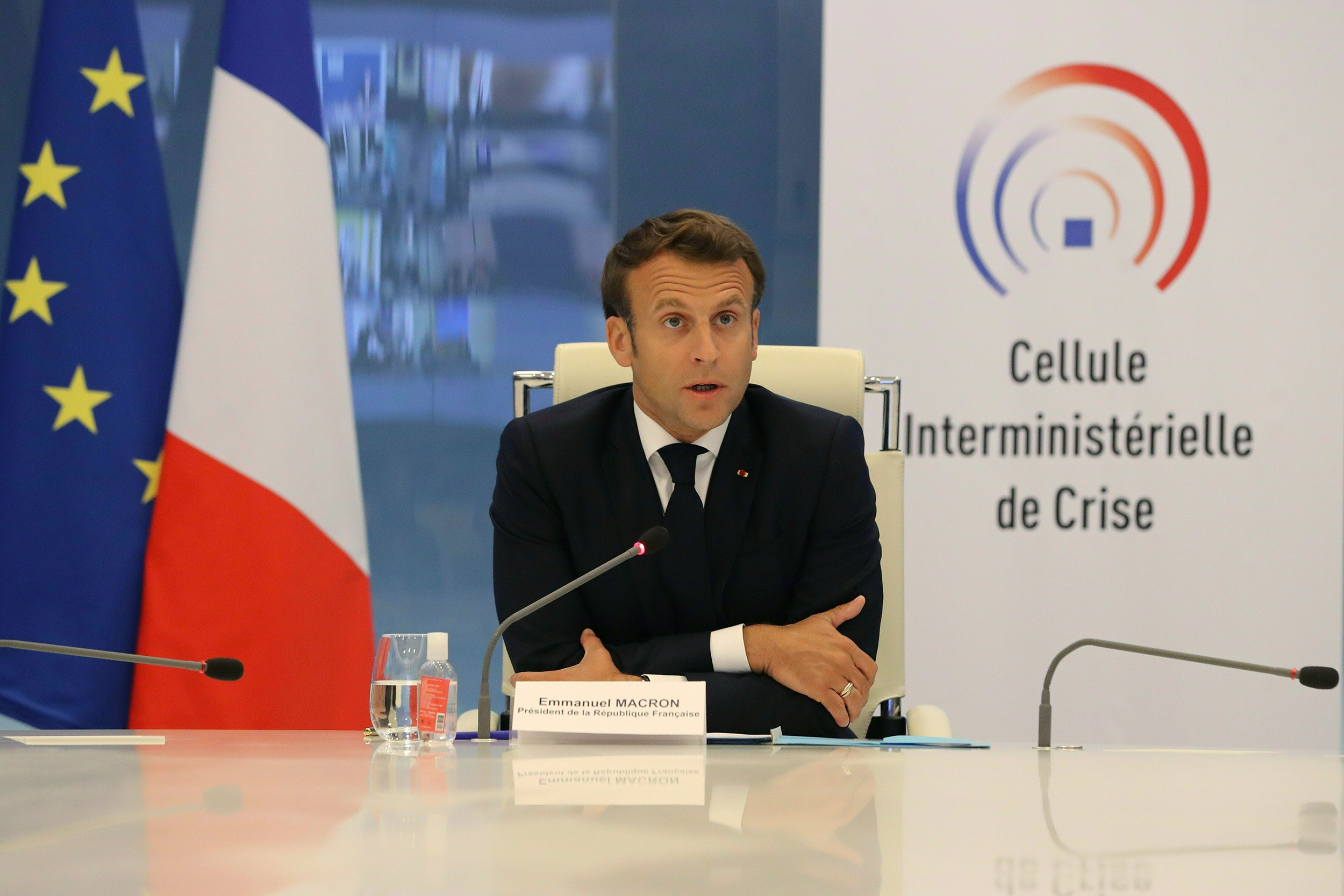 French president Emmanuel Macron takes part in a videoconference with region prefects at the Crisis Center of the French Interior Ministry in Paris, on Wednesday, May 13. 
