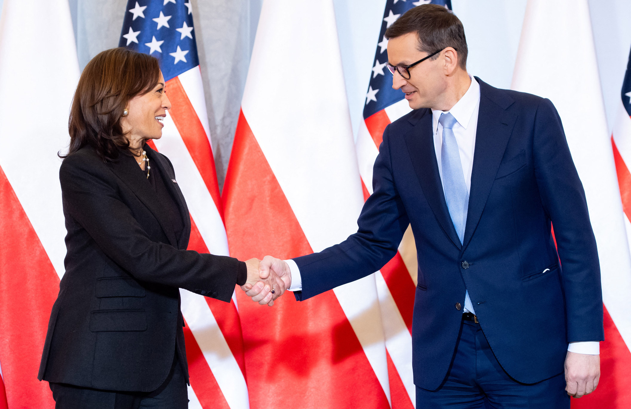 Polish Prime Minister Mateusz Morawiecki greets US Vice President Kamala Harris as she arrives in Warsaw on Thursday.