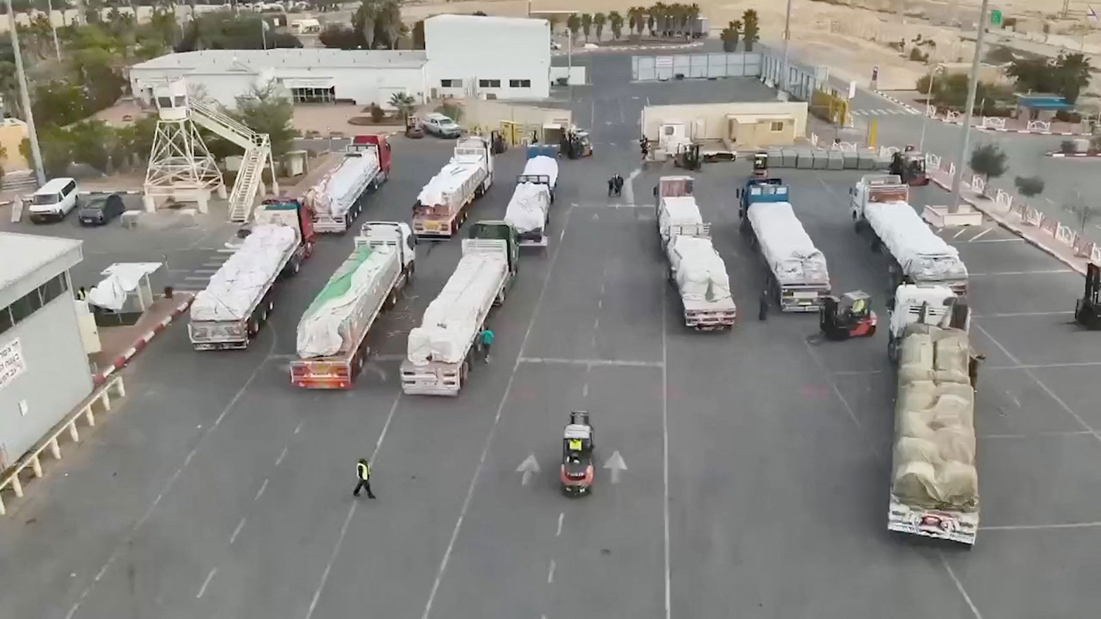 Humanitarian aid trucks seen at  Nitzana crossing, Israel on November 28, in this screengrab from a handout video. 