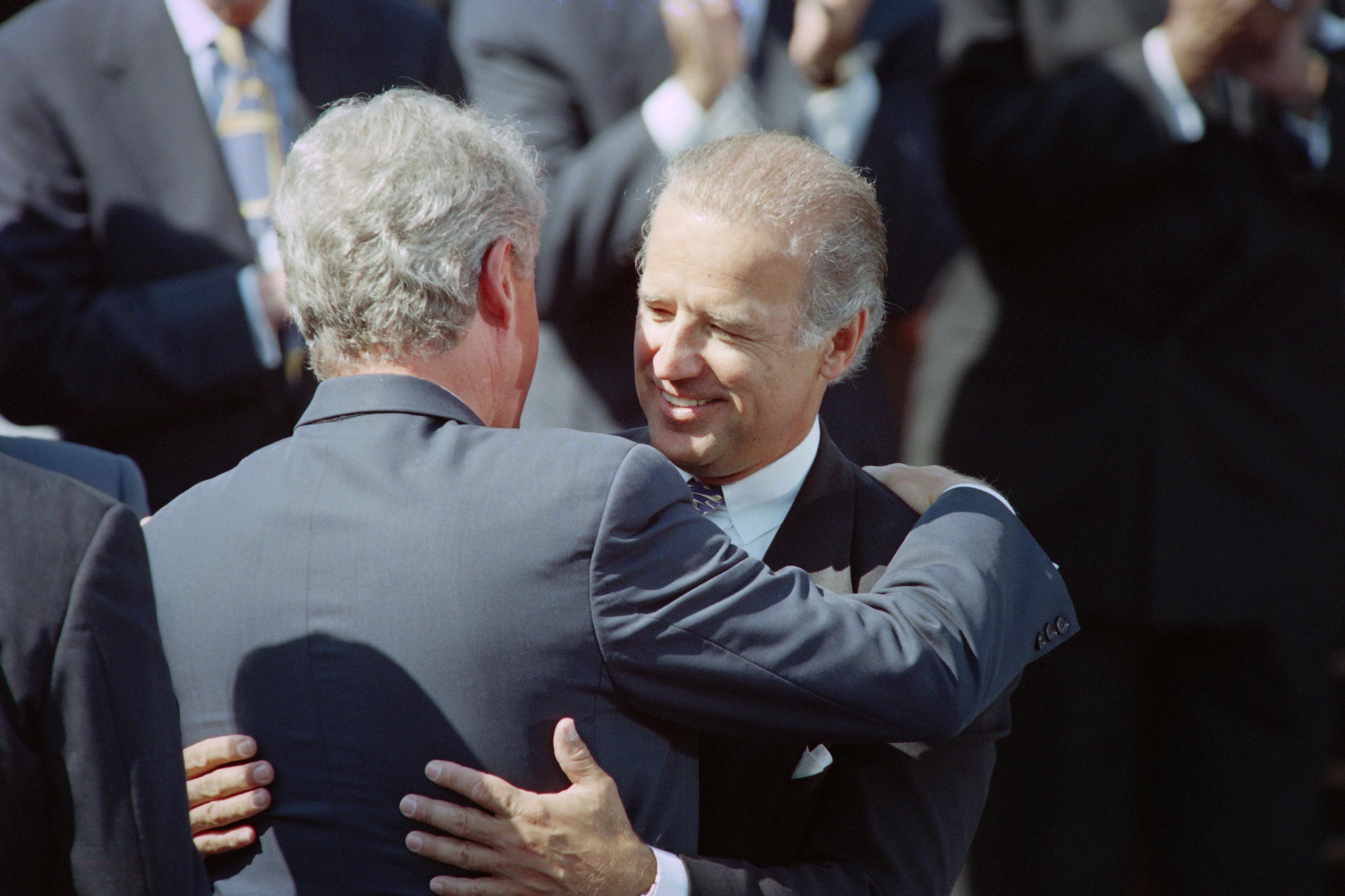 Then-President Bill Clinton hugs then-Sen. Joseph Biden, in September 1994 during a signing ceremony for a crime bill at the White House.
