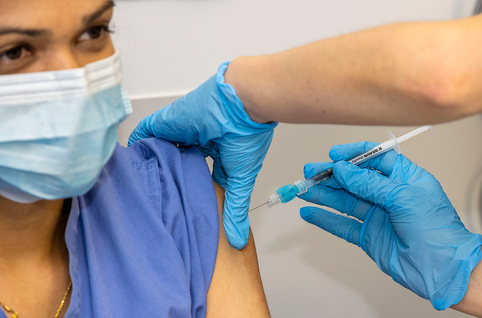 Healthcare worker Nithya Rajendran receives an injection of the Pfizer-BioNTech Covid-19 vaccine at St James's Hospital in Dublin on December 29, 2020.