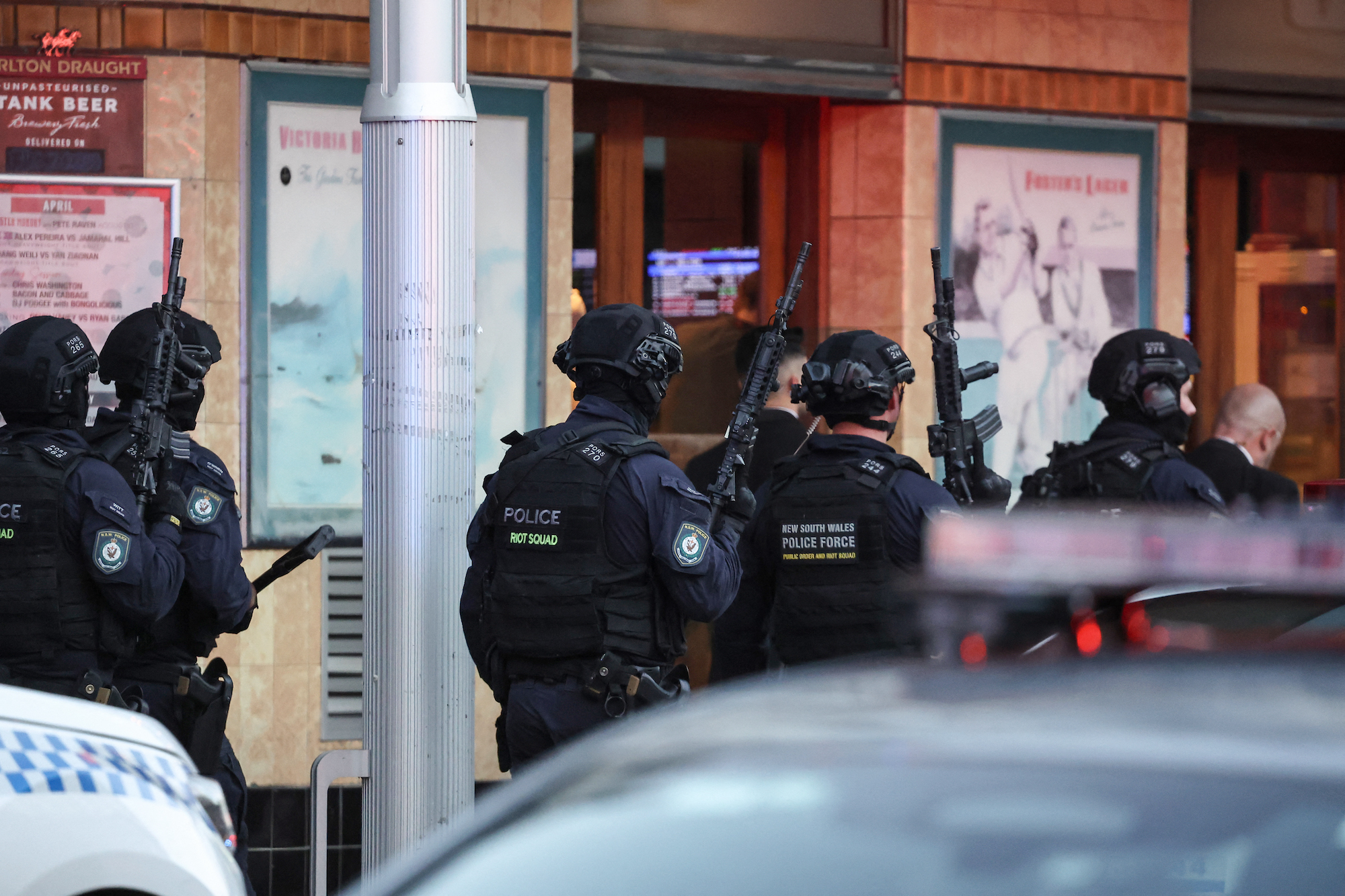 Police are seen outside Westfield Bondi Junction mall in Sydney on Saturday.