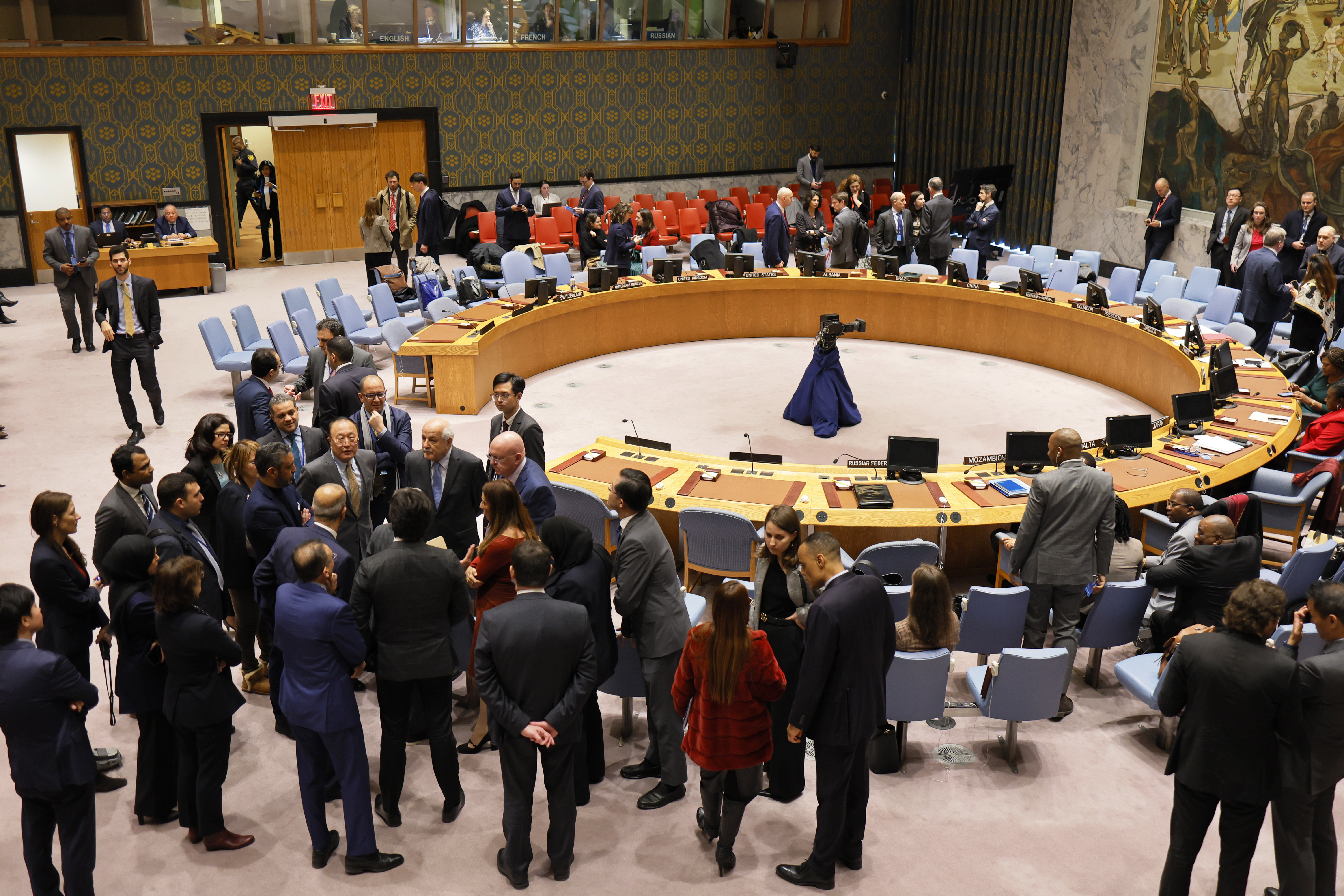 Members of the United Nations Security Council hold sideline meetings as they take a break at the UN headquarters in New York on December 19.