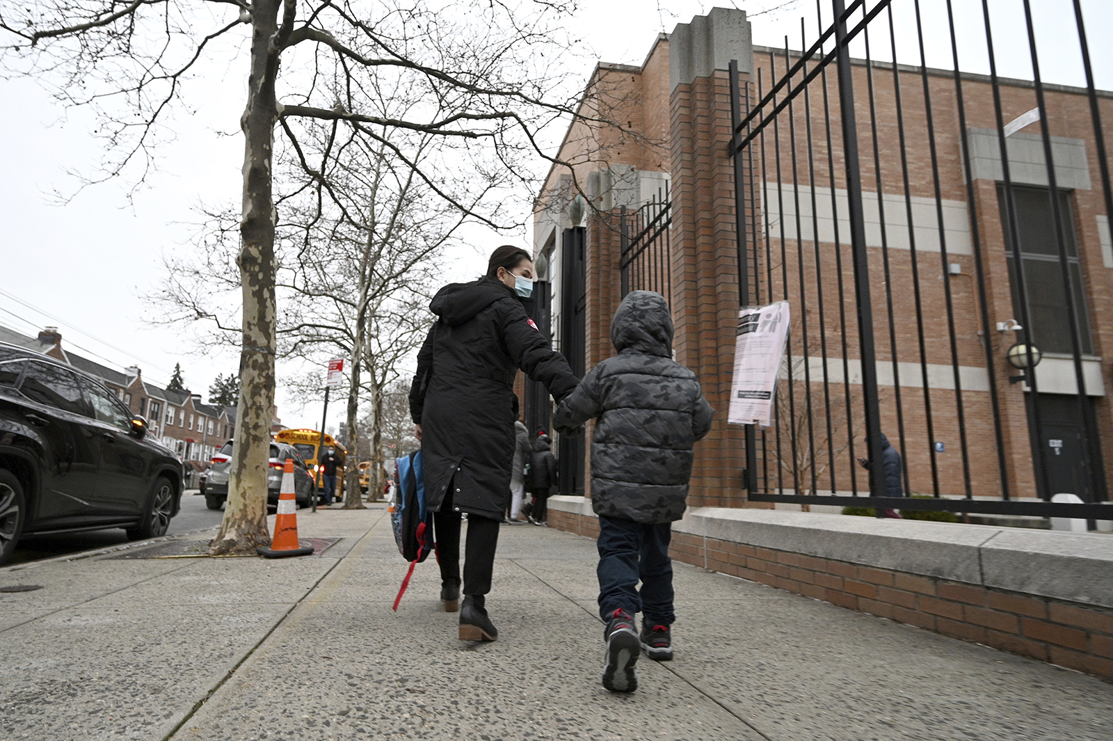 A parent accompanies her child to school on the first day back after winter break, in the Queens borough of New York City on January 3.