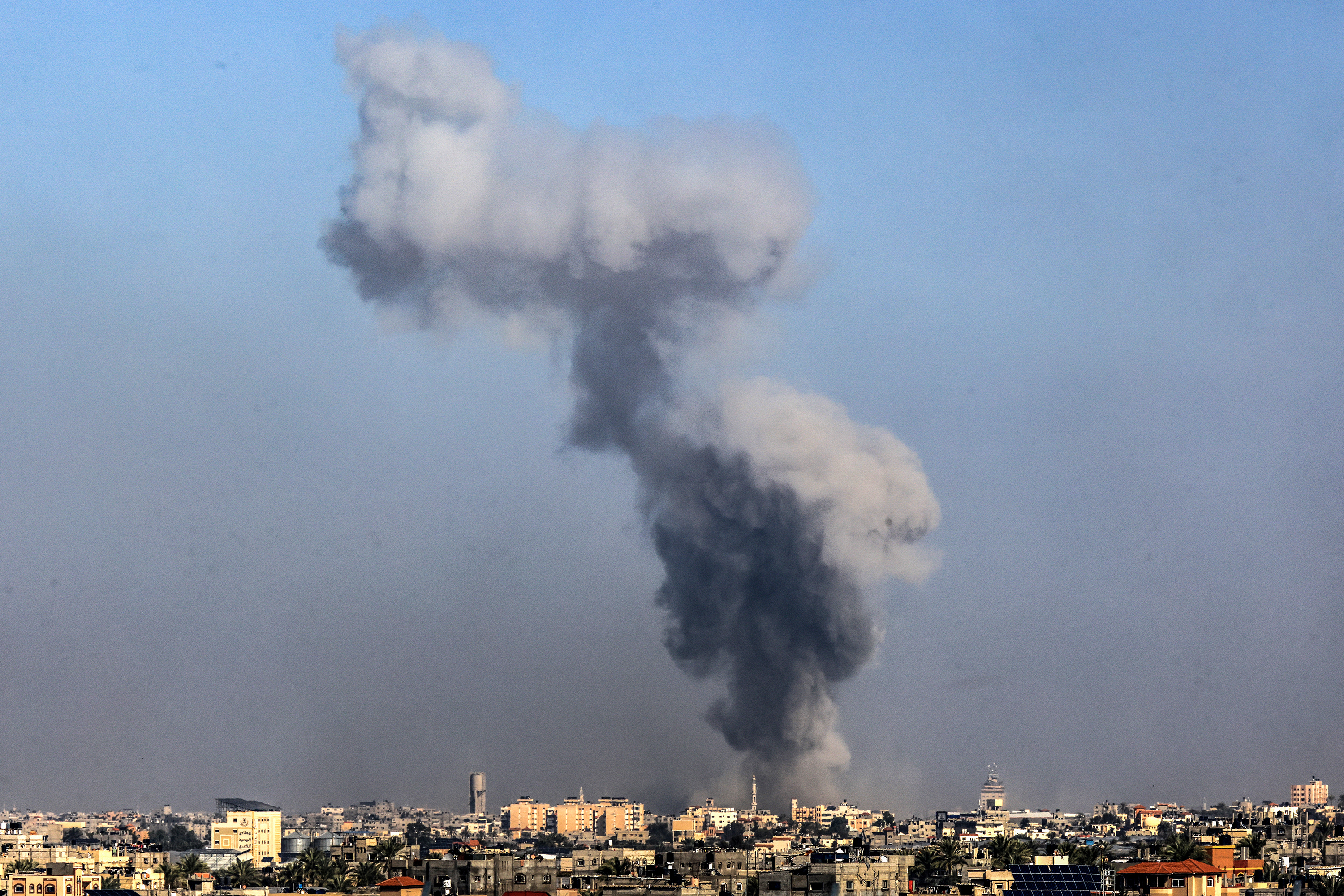 A photo taken from Rafah, Gaza, on January 6 shows smoke billowing over Khan Younis, Gaza, during an Israeli bombardment.