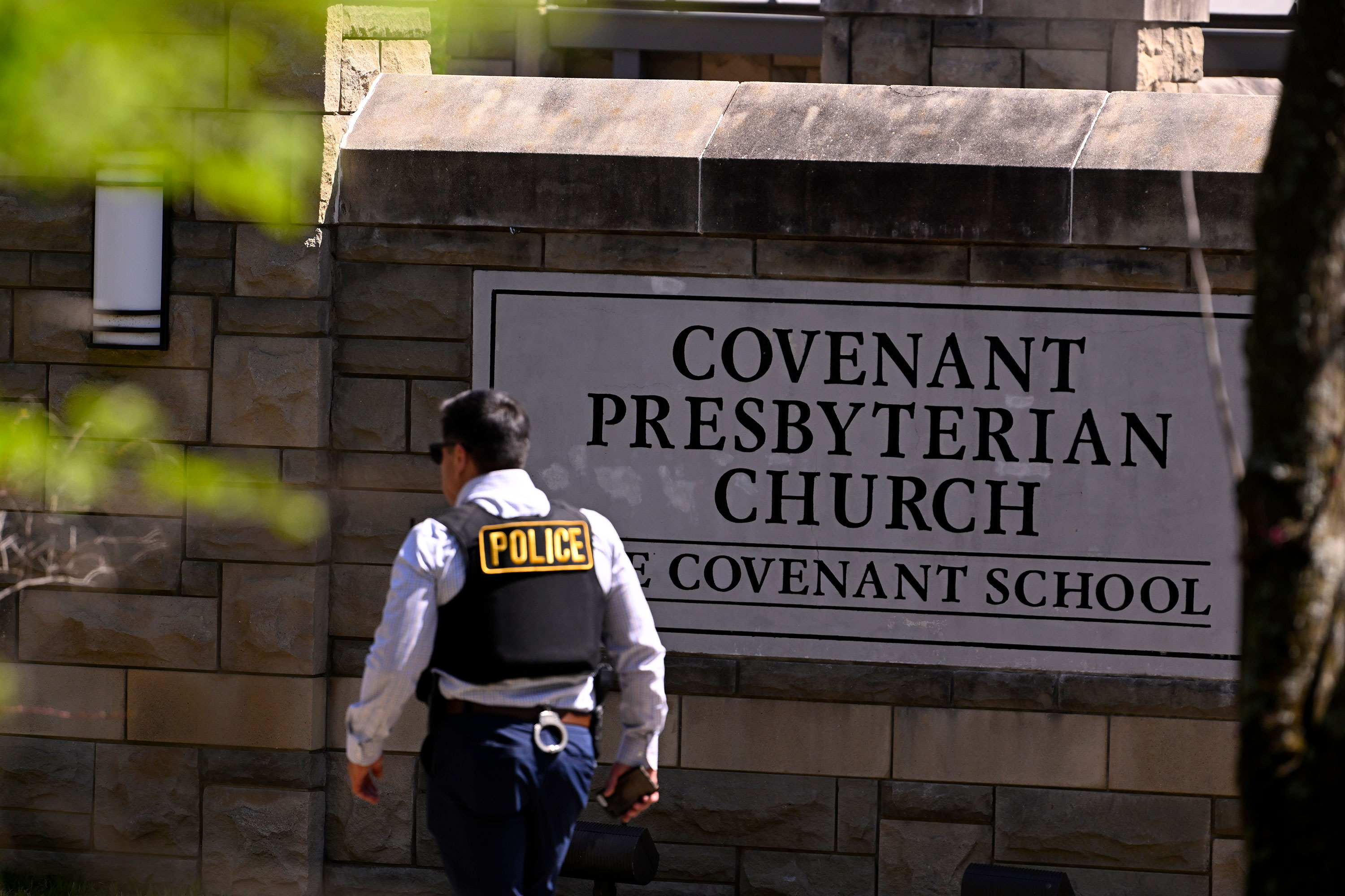 A police officer walks by an entrance to Covenant School in Nashville on Monday.