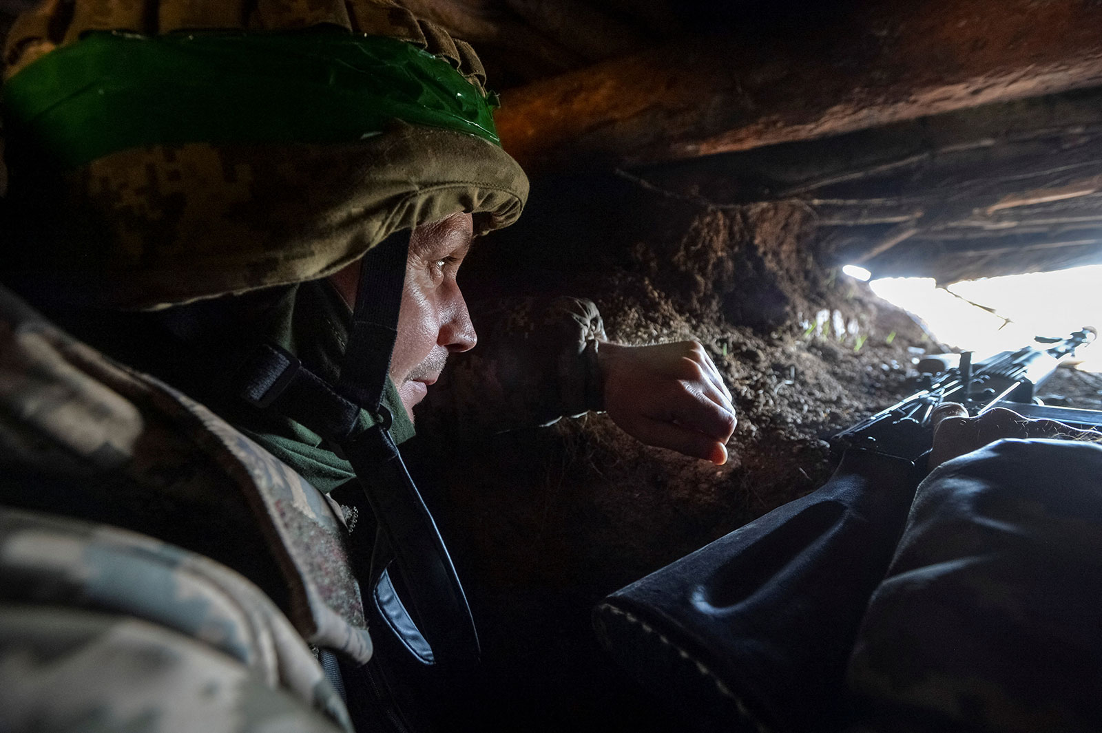 A Ukrainian service member is seen in a trench at a position on a front line near the city of Bakhmut, Ukraine, on April 10. 
