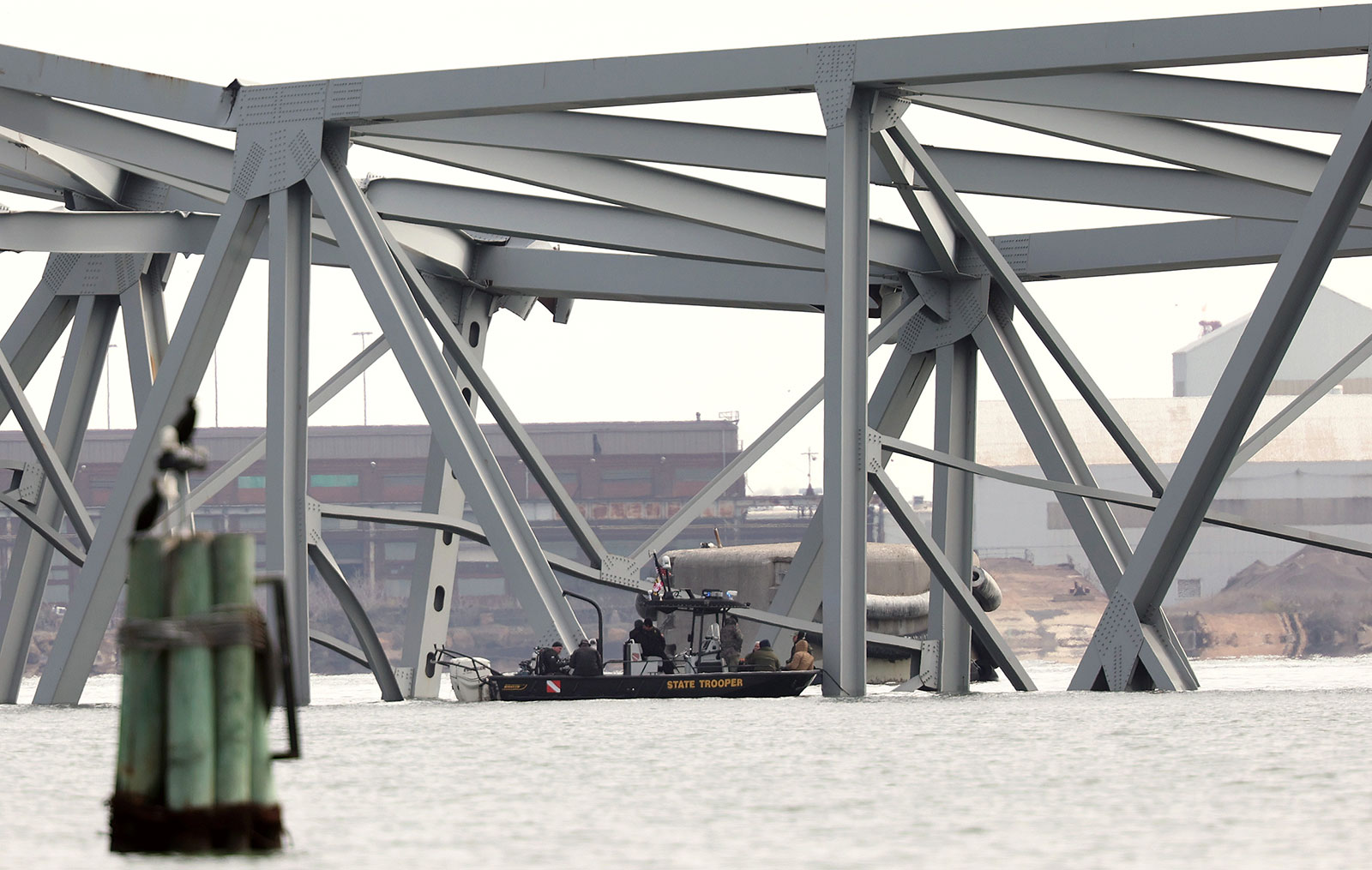 Maryland state troopers patrol at the scene after the cargo ship Dali ran into and collapsed the Francis Scott Key Bridge on Tuesday in Baltimore.