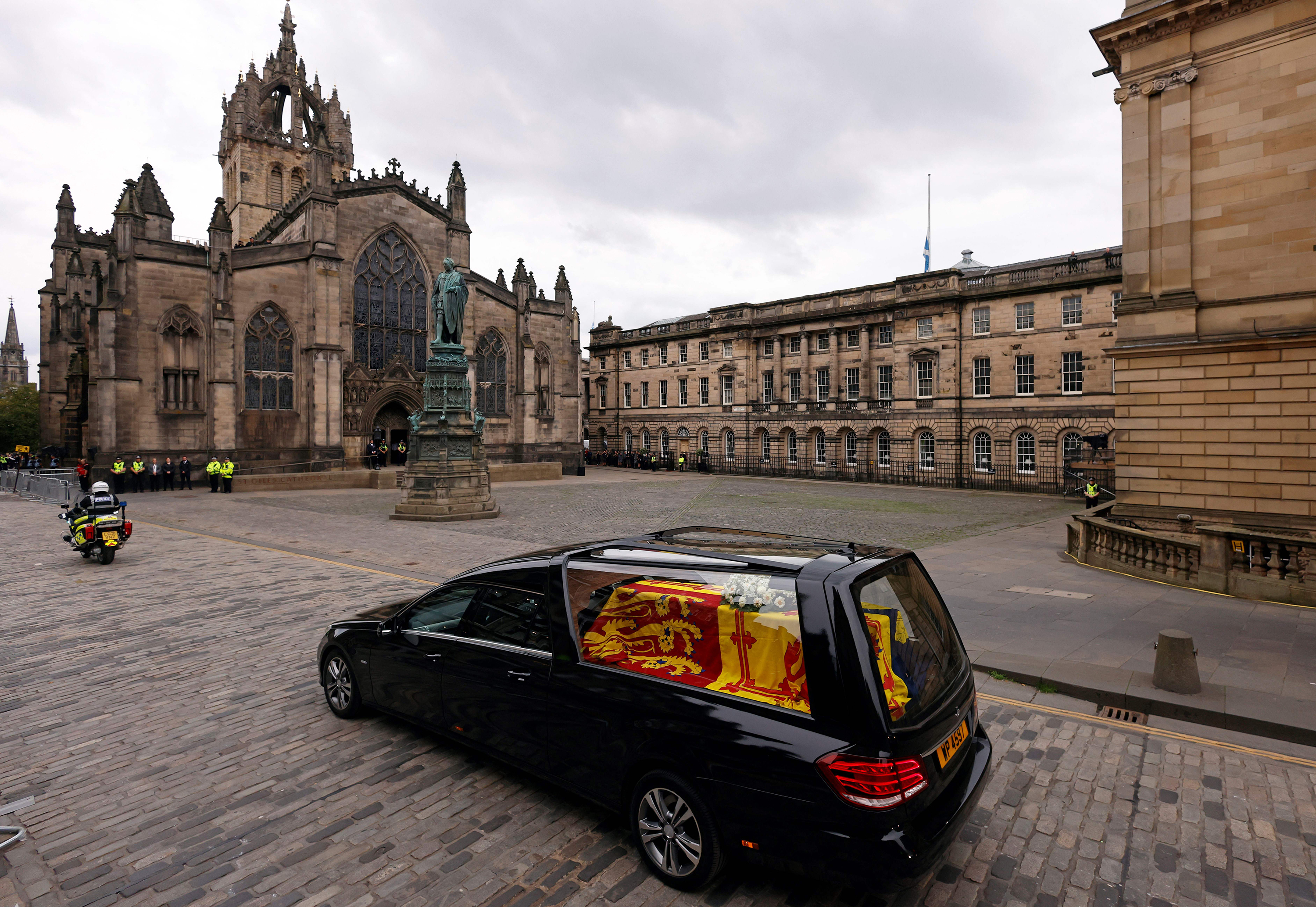 The hearse carrying the coffin of Queen Elizabeth II is driven through Edinburgh toward the Palace of Holyroodhouse on Sunday.