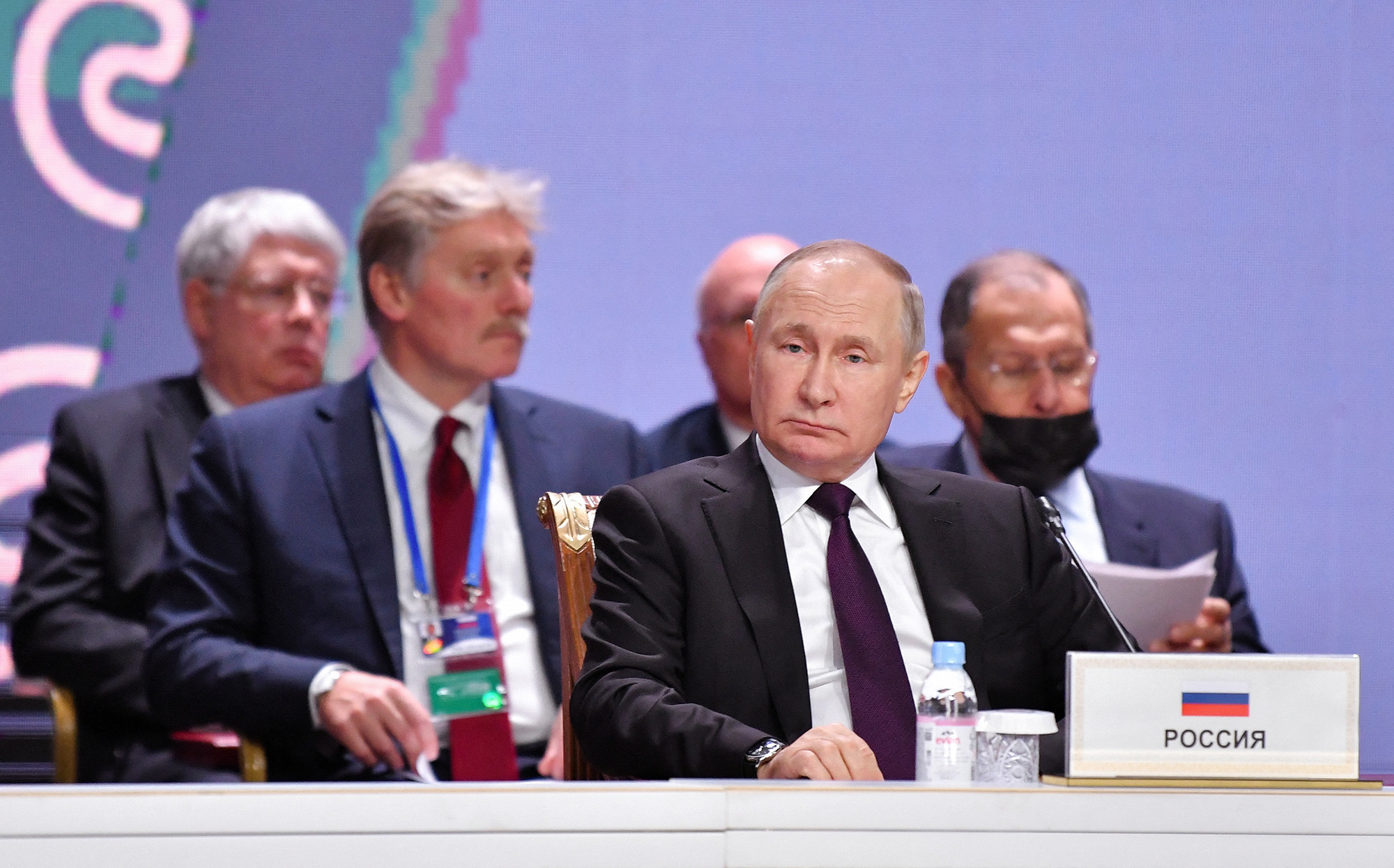 Russian President Vladimir Putin, flanked by Foreign Minister Sergei Lavrov and Kremlin spokesman Dmitry Peskov, attend the summit of leaders of the Commonwealth of Independent States (CIS) in Astana, Kazakhstan, on October 14,