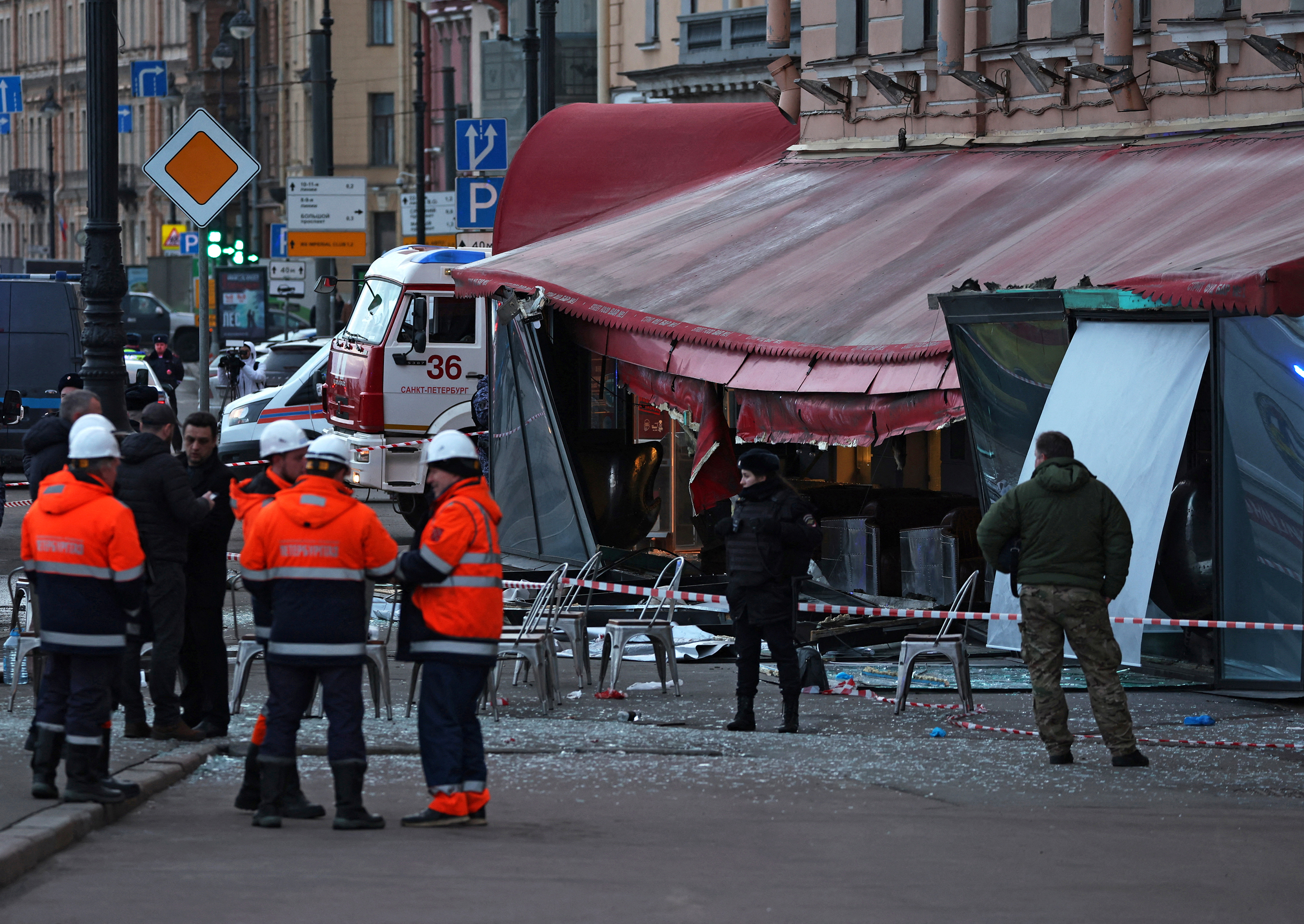 Investigators and members of emergency services work at the site of an explosion at a cafe in St. Petersburg, Russia, on April 2. 