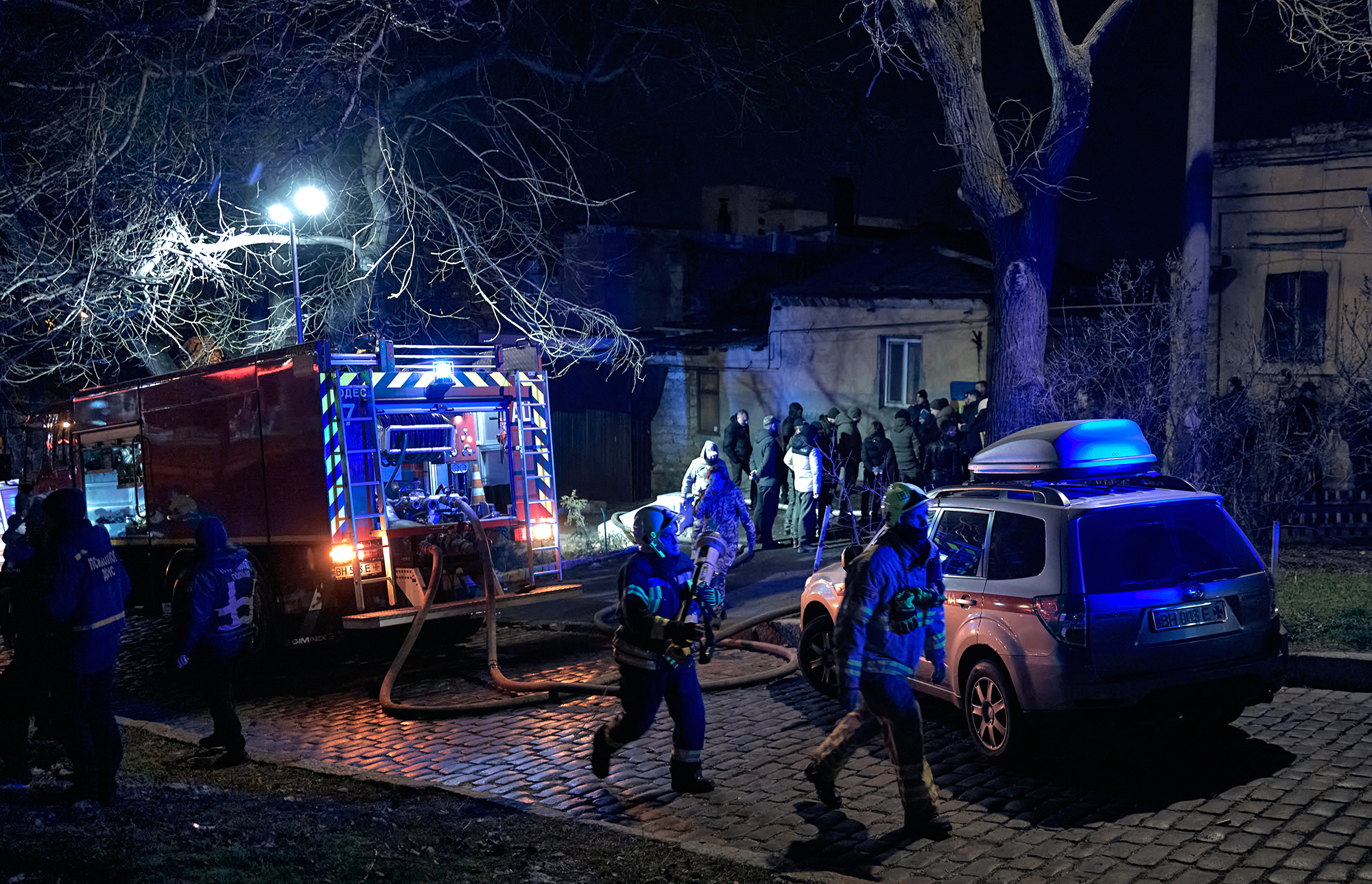 Emergency services respond to the scene of an air strike in Odesa, Ukraine, on February 24. 