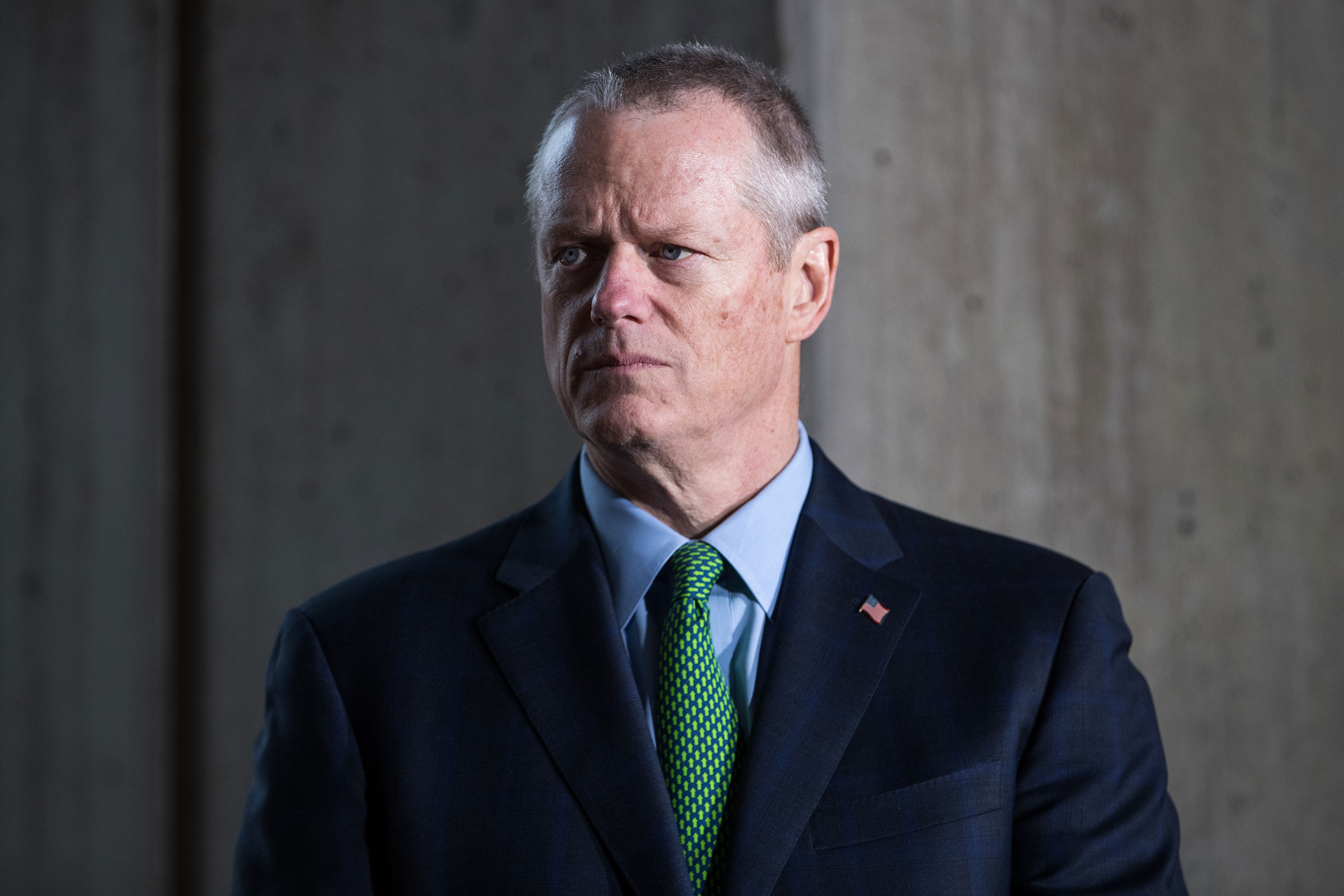 Gov. Charlie Baker attends a press conference announcing the postponement of the Boston Marathon on March 13. 