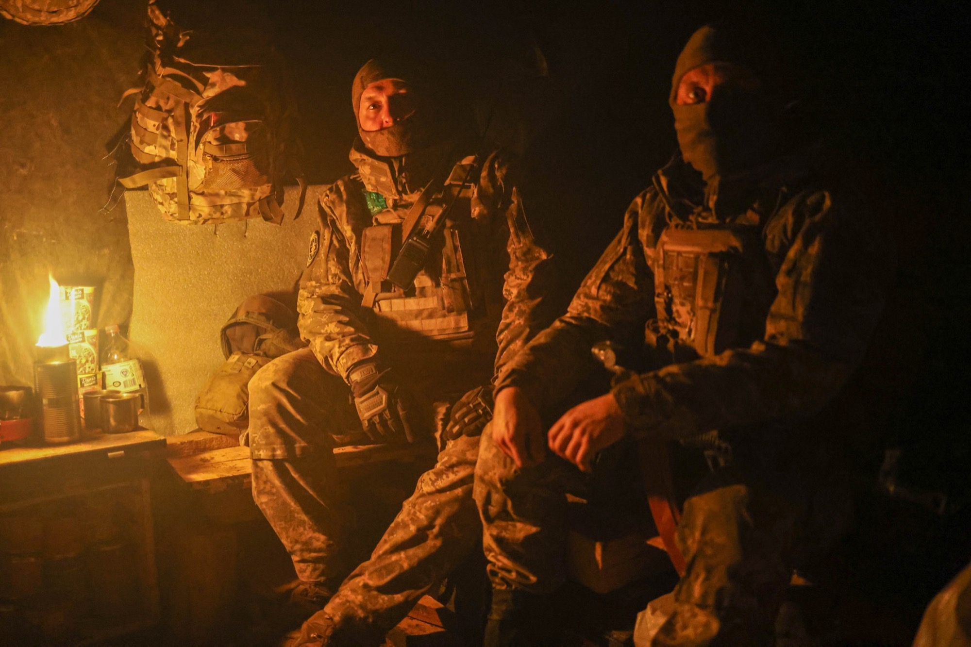 Ukrainian soldiers live in a candle-lit bunker southwest of Bakhmut, in eastern Ukraine.