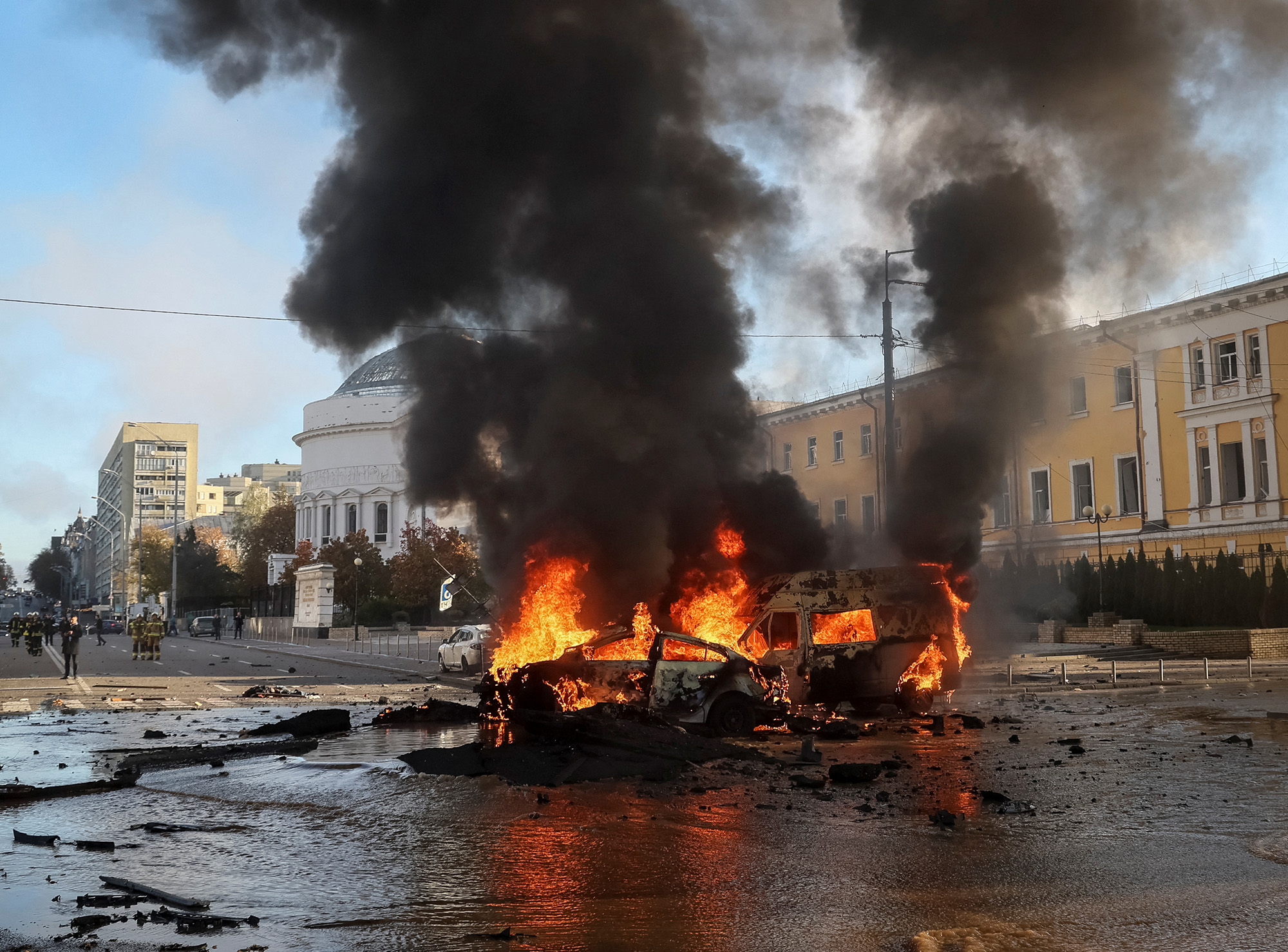 Cars burn after a Russian military strike in central Kyiv, Ukraine, on October 10.