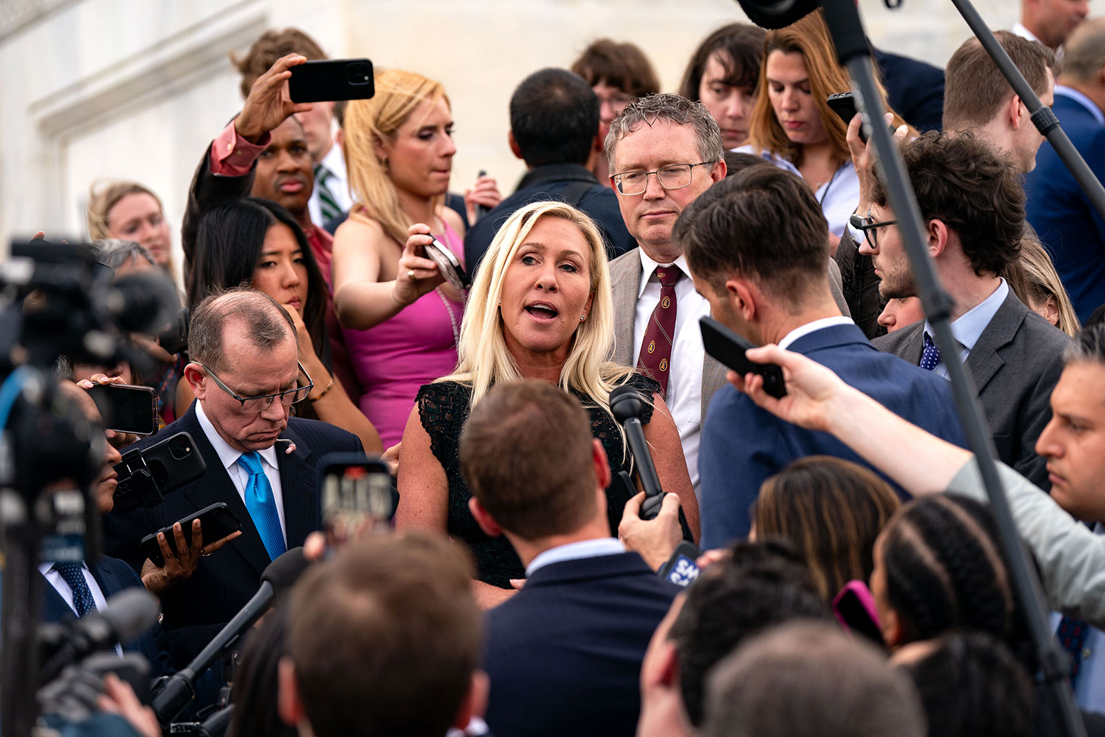 Rep. Marjorie Taylor Greene and Rep. Thomas Massie speak to members of the press on the steps of the House of Representatives at the US Capitol on Wednesday, May 8.
