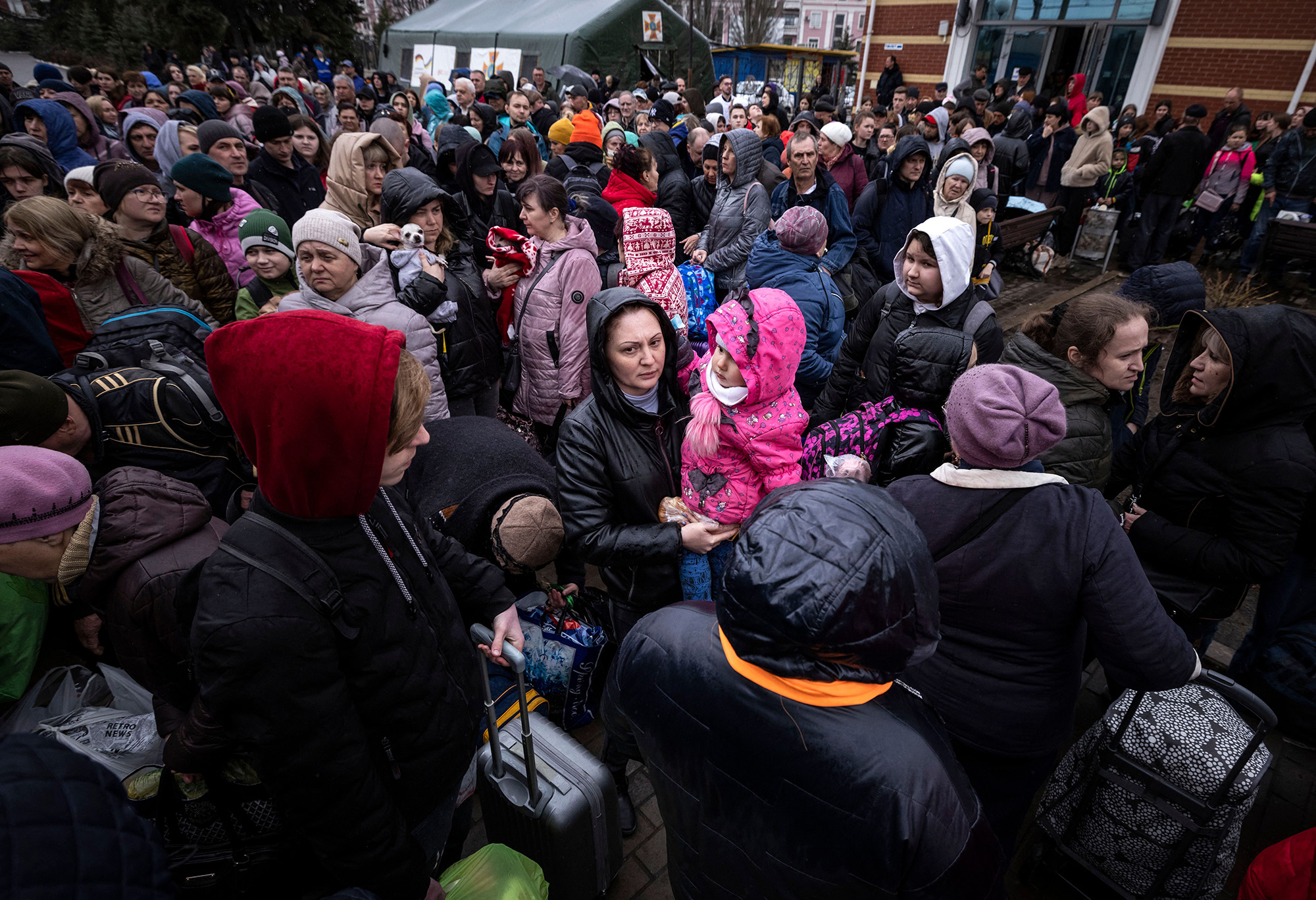 Families arrive at the main train station as they flee the eastern city of Kramatorsk, in the Donbas region of Ukraine, on April 3.