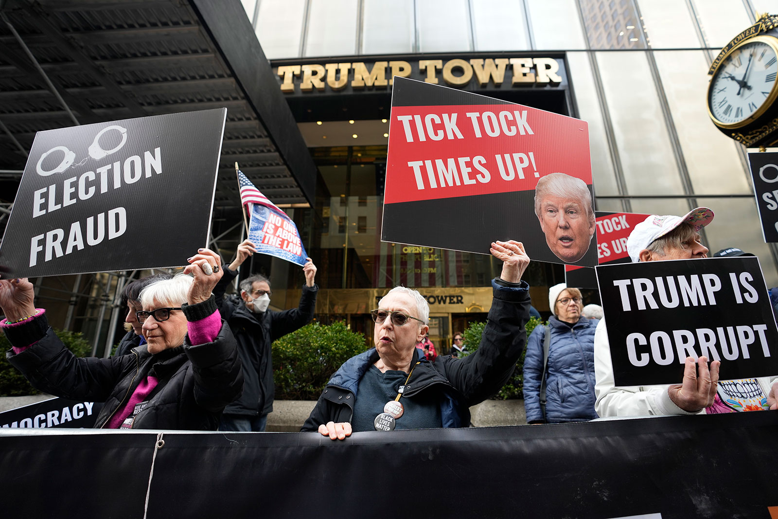 Protesters gather outside Trump Tower on Friday, March 31, in New York.