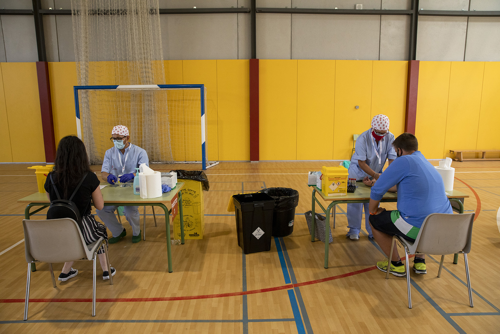 Health workers draw blood from teachers at a temporary testing point in Diego Velazquez secondary school during the coronavirus pandemic on September 2, in Torrelodones, near Madrid, Spain. 