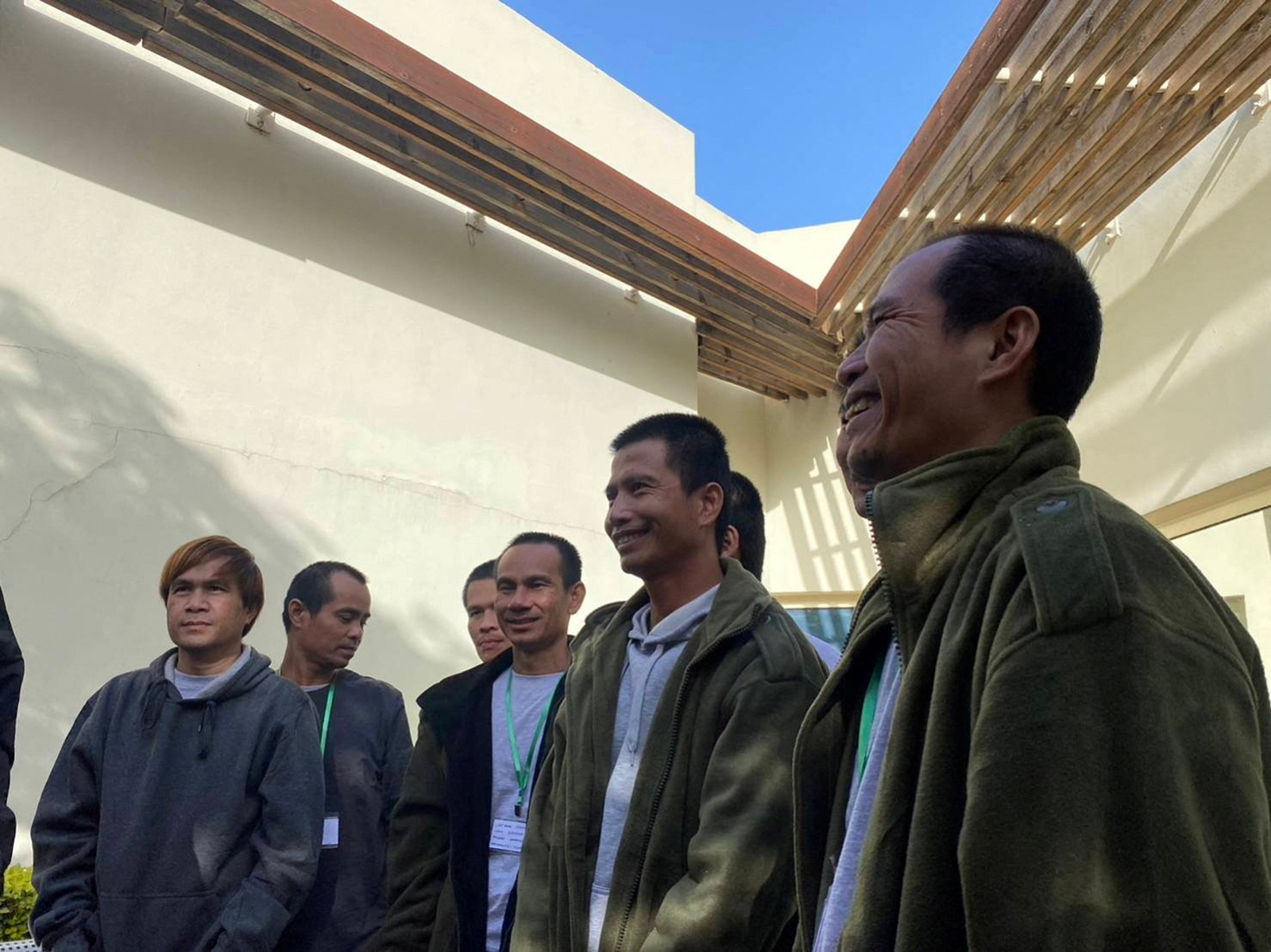 Thai citizens who were released from Gaza stand together during a visit by Ambassador of Thailand in Israel, Pannabha Chandraramya, in Be'er Ya'akov, Israel on November 26.
