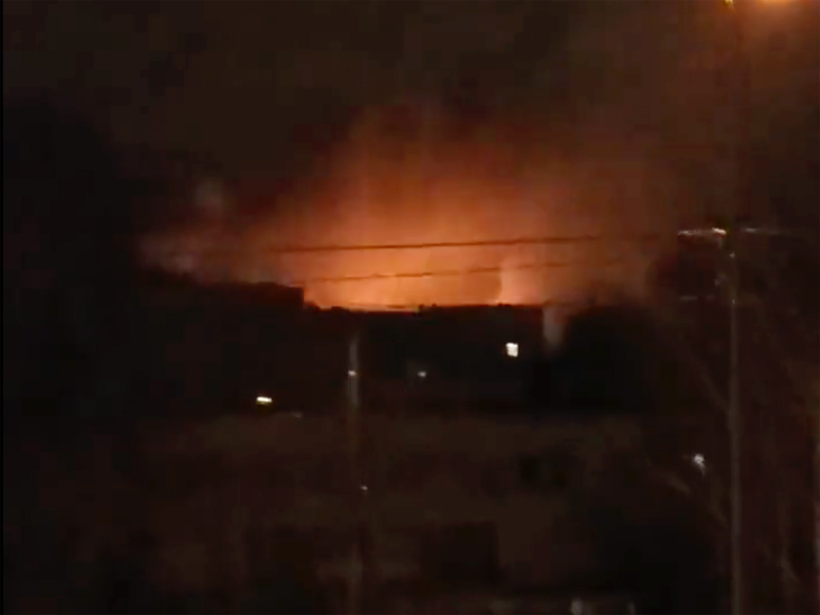 A frame taken from a video shared on Twitter shows explosions purportedly taken near the Kyiv Zoo.