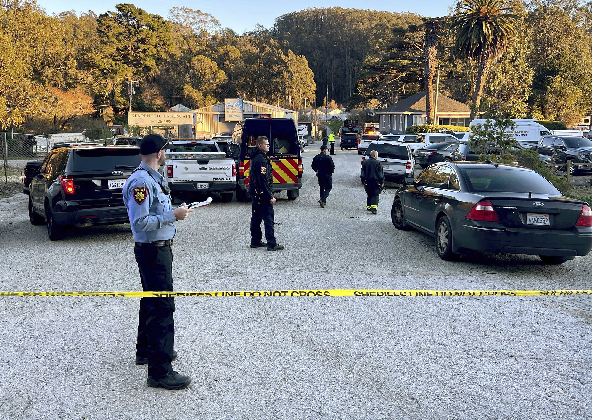 First responders work one of several crime scenes where multiple people were shot and killed on January 23, 2023, off state Highway 92 in Half Moon Bay, California.