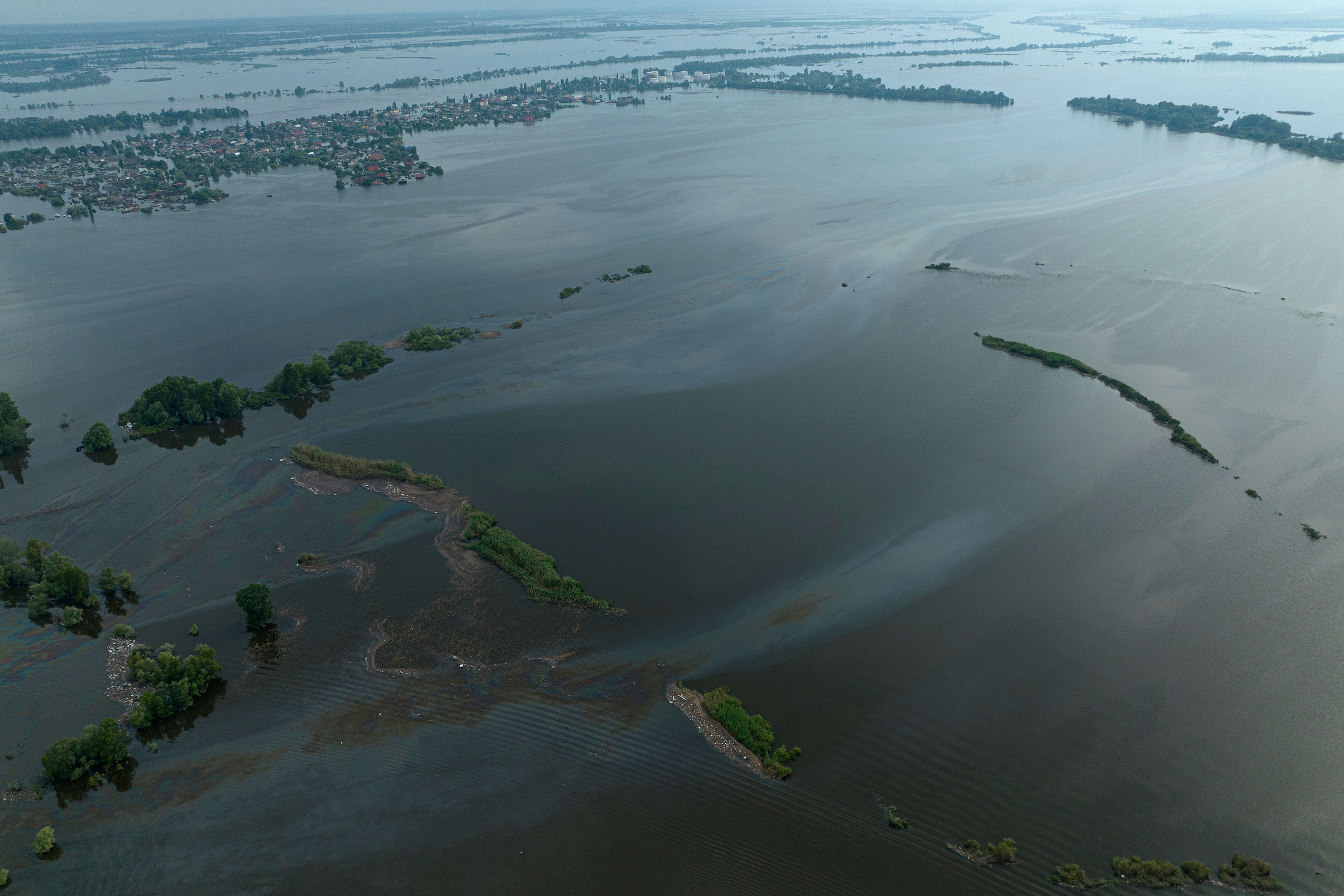 Oil pollution is seen in the Dnipro River in flooded Kherson on June 10, following the collapse of the Nova Kakhovka dam. 