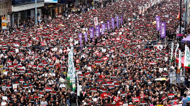 Protesters attend a demonstration demanding Hong Kong's leaders to step down.