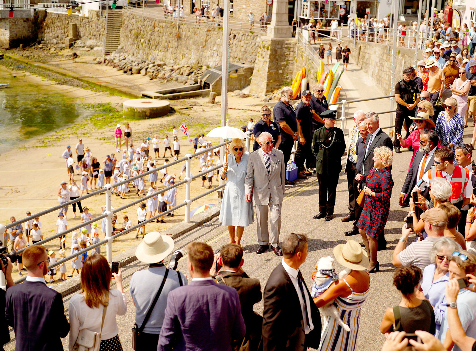 Prince Charles and Camilla, Duchess of Cornwall visit a fishing village in Cornwall, England, on July 18.