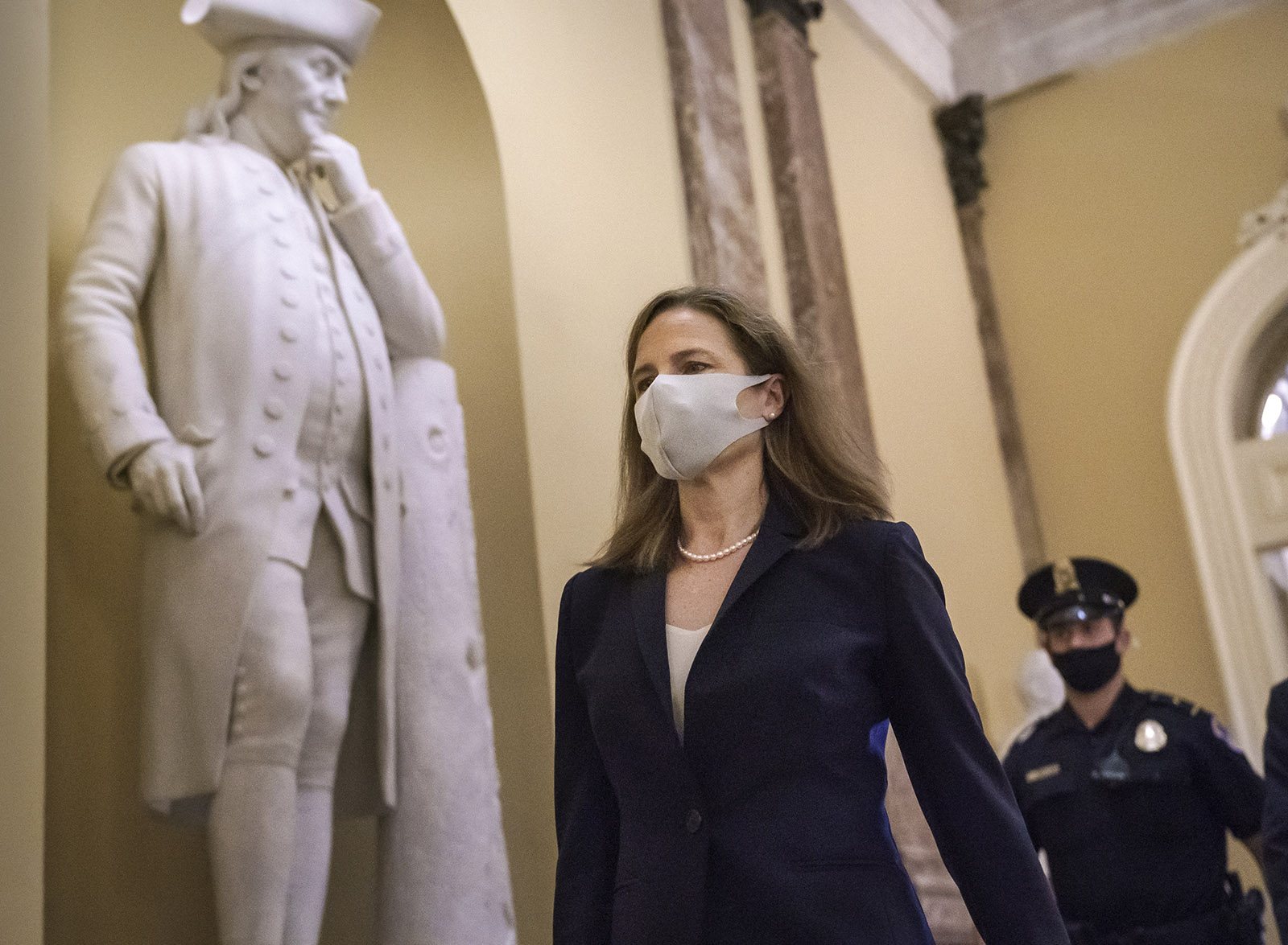 Judge Amy Coney Barrett, President Donald Trump's nominee for the Supreme Court, arrives for closed meetings with senators, at the Capitol in Washington on Wednesday, October 21. 