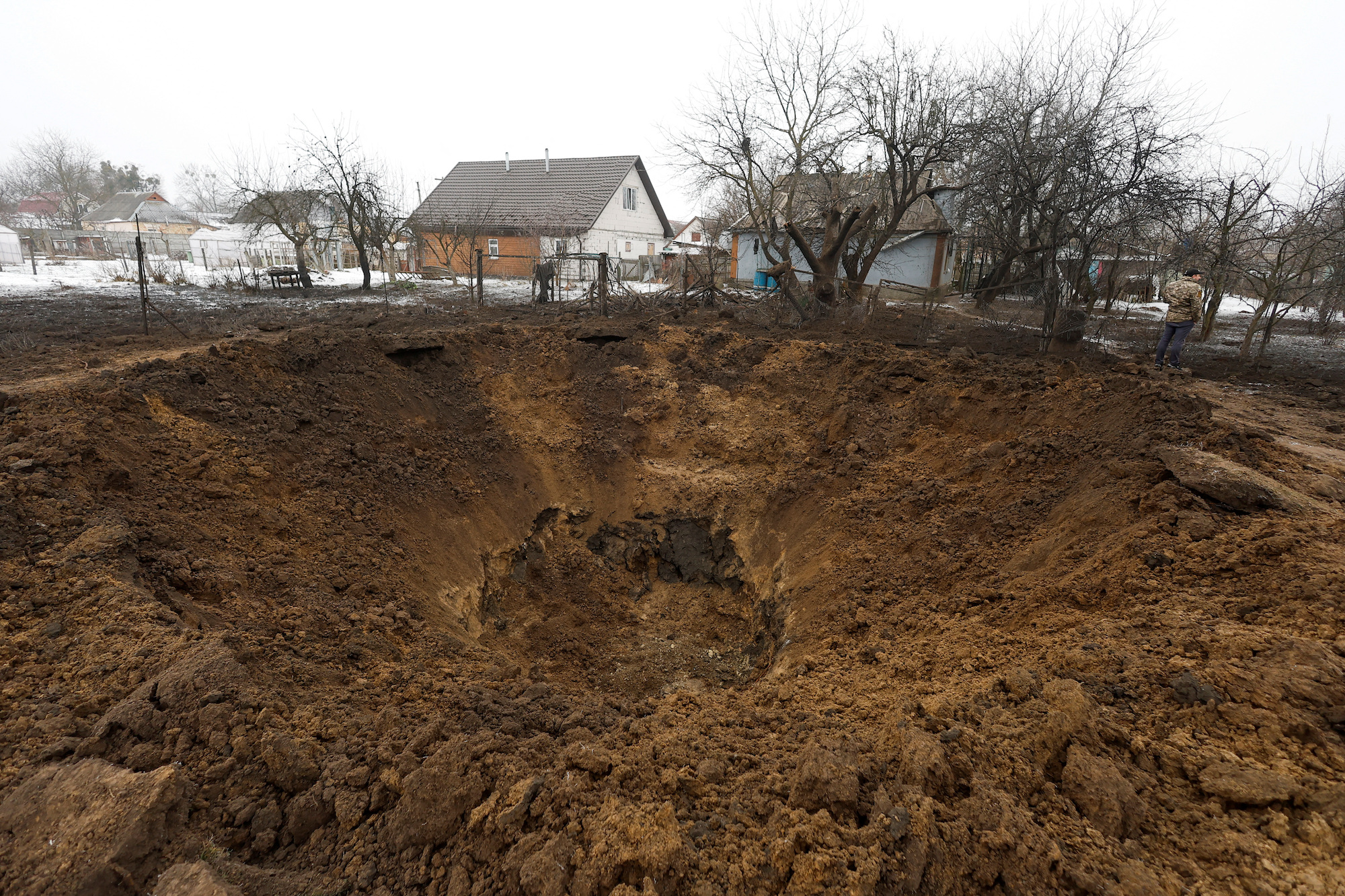 A view of a crater left by a Russian missile in the village of Kopyliv, Kyiv region on Saturday.