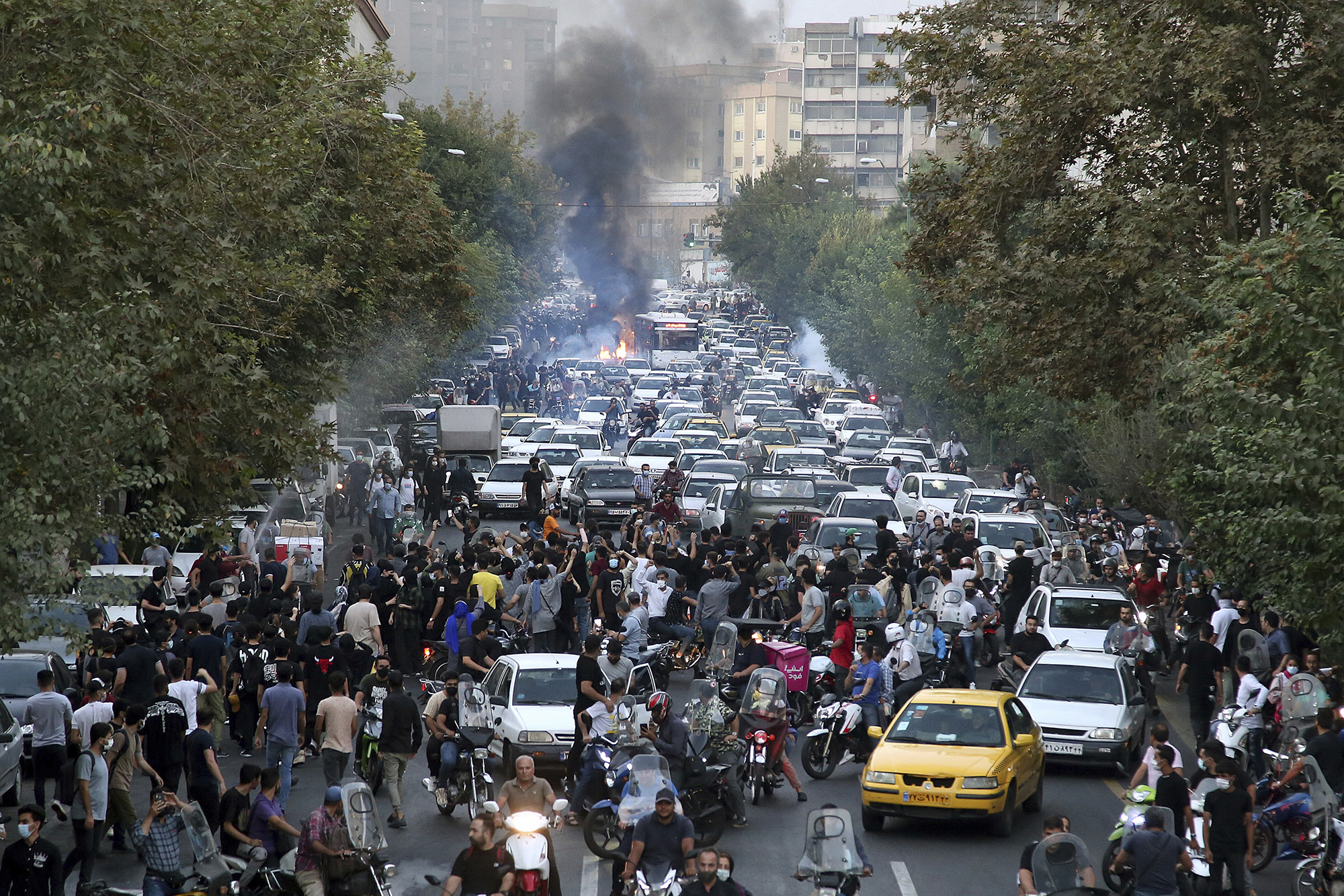 Protesters chant slogans during a protest over the death of a woman who was detained by the morality police, in downtown Tehran, Iran, on September 21, 2022.
