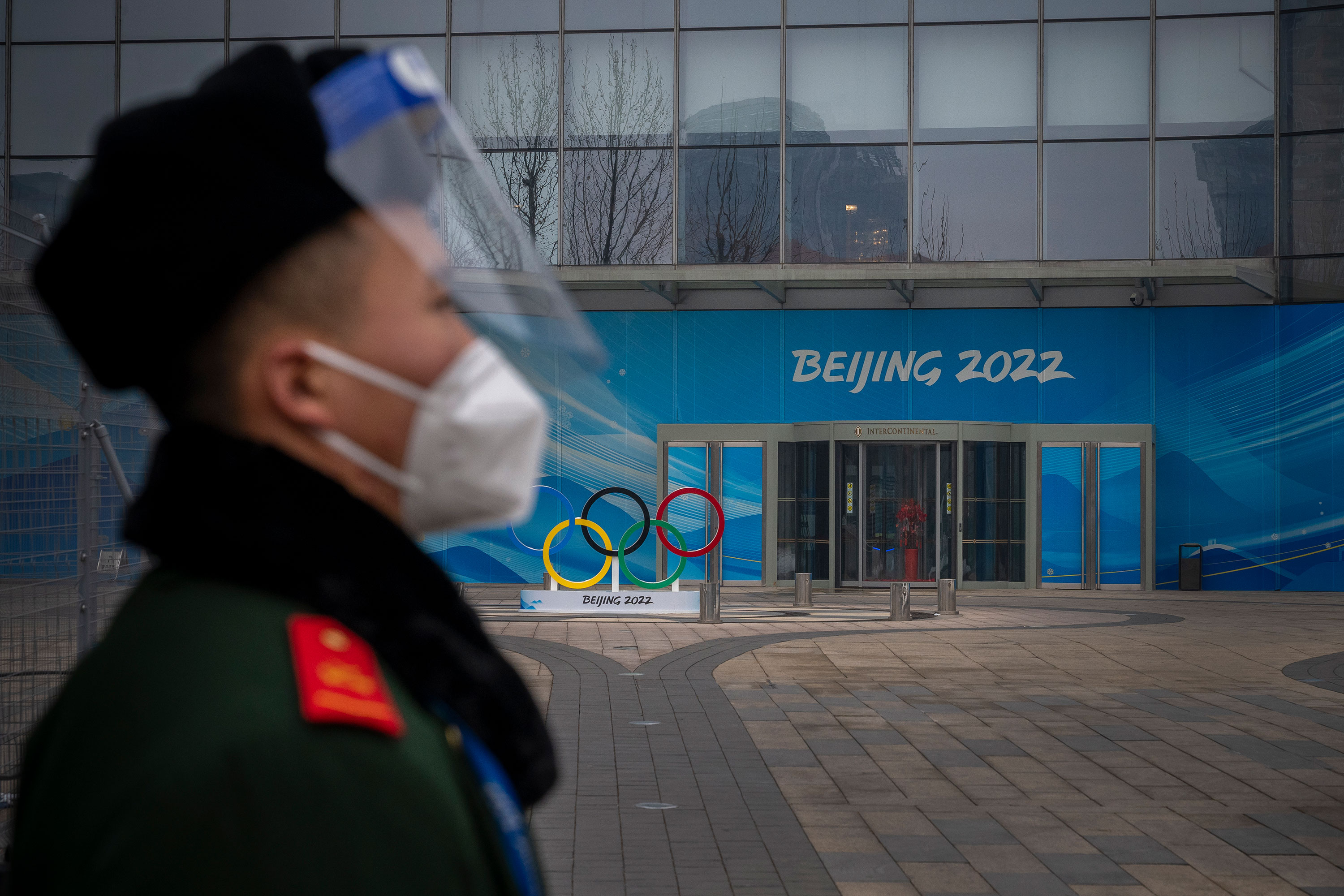 A security guard stands behind a barricade in an area not accessible to the general public at Olympic Park in Beijing on January 23.