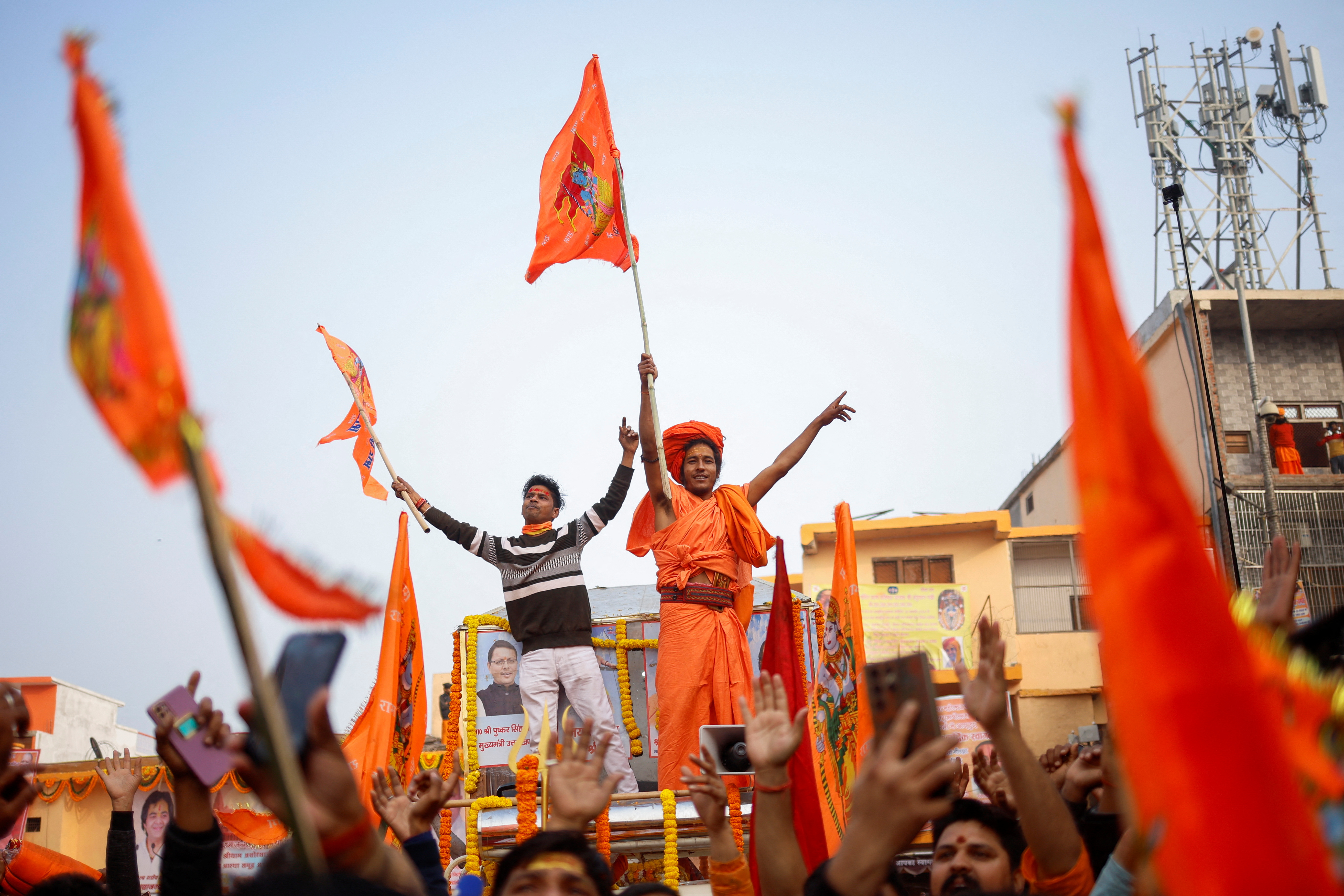 Hindu devotees dance during a procession as they arrive in Ayodhya, India, on January 21.