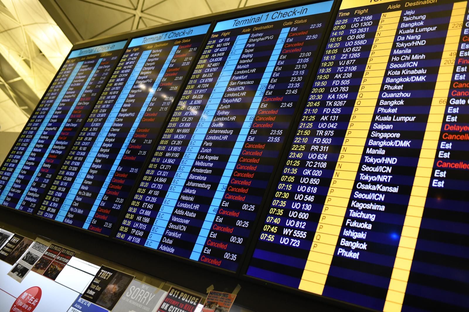 Check-in boards showing canceled flights at Hong Kong airport on August 13, 2019.