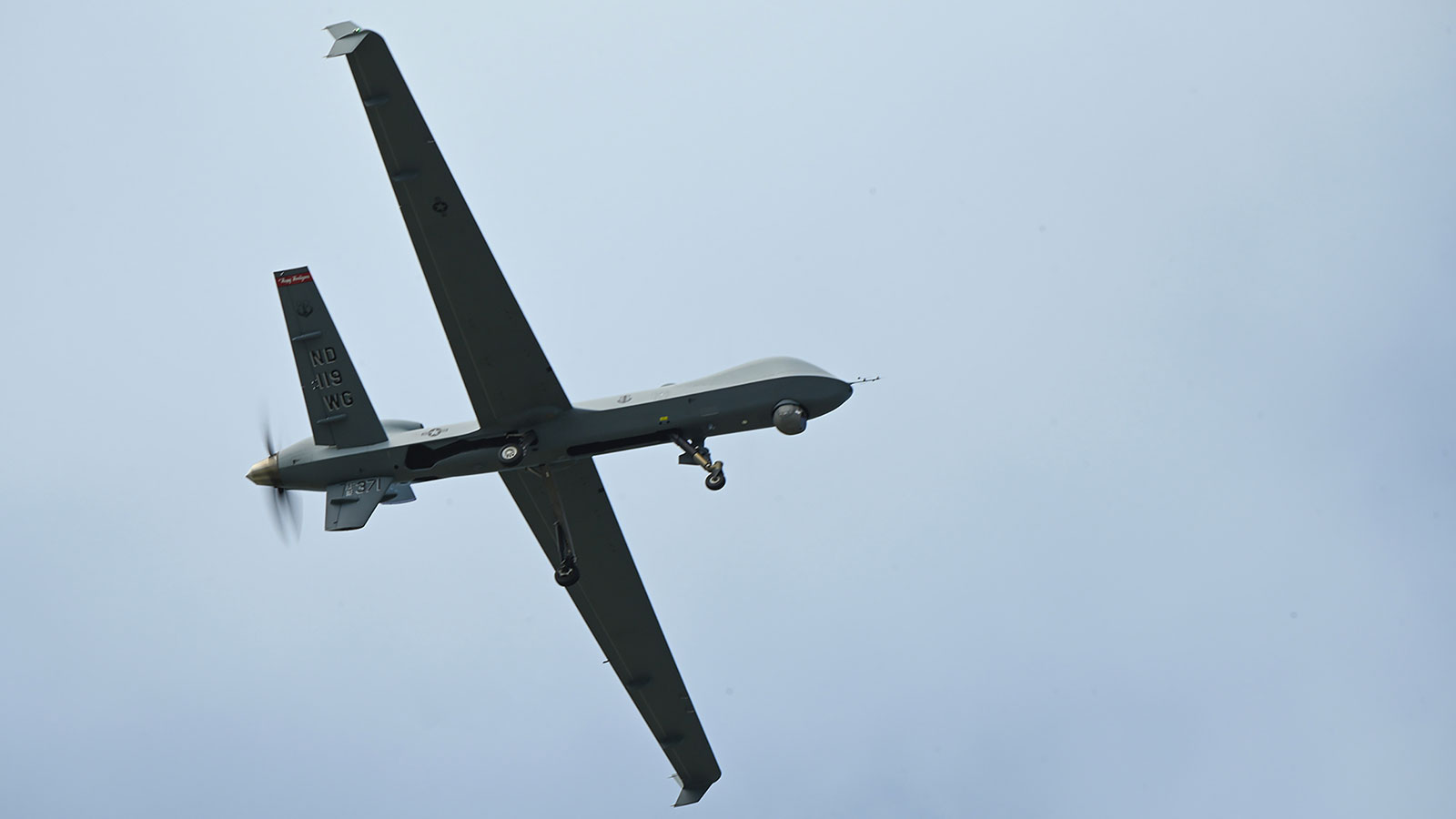 In this February 21 photo, a US Air Force 119th Wing MQ-9 Reaper flys over an airfield at Andersen Air Force Base, Guam.