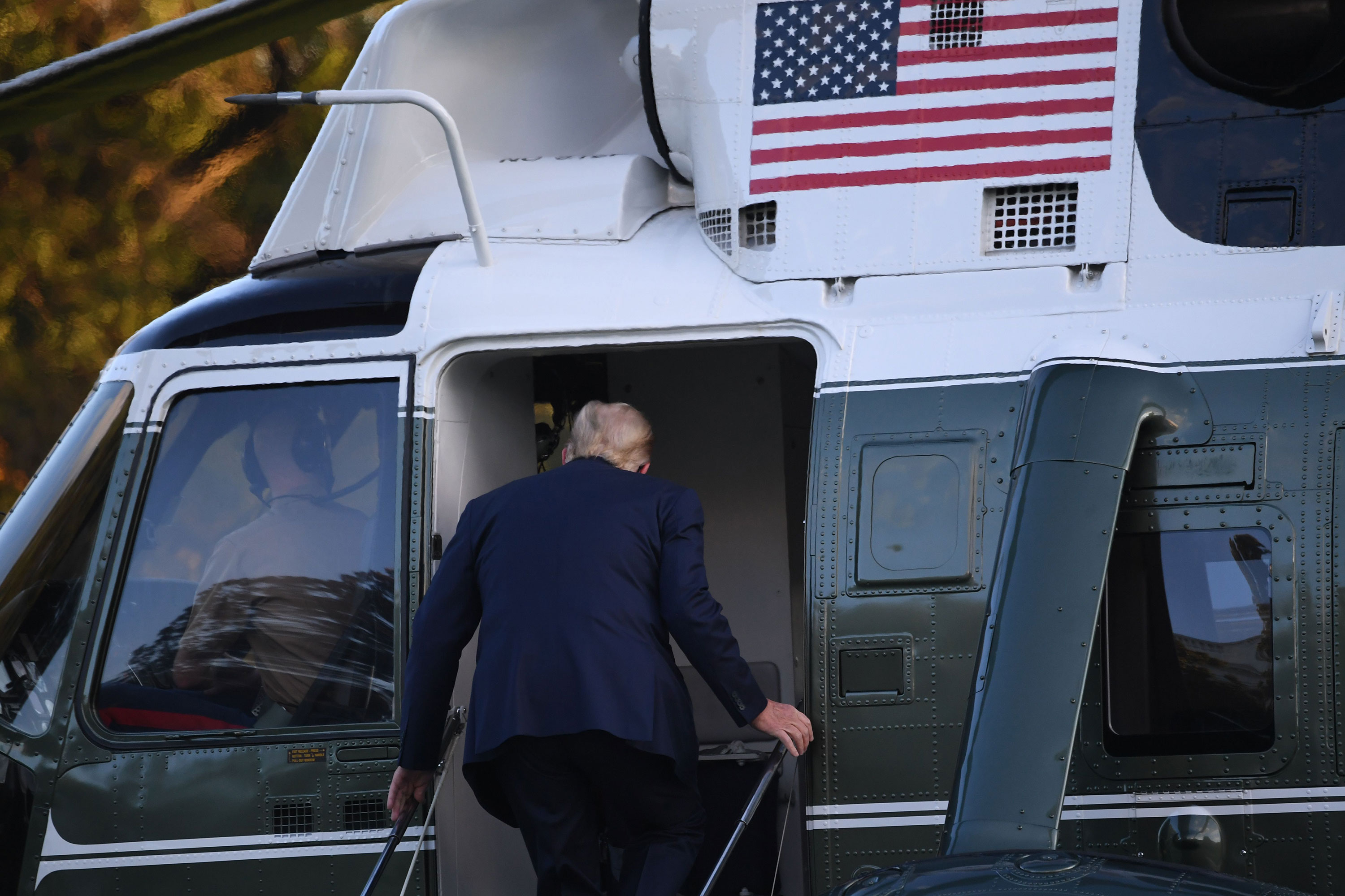 President Donald Trump boards Marine One before heading to Walter Reed Military Medical Center on October 2.