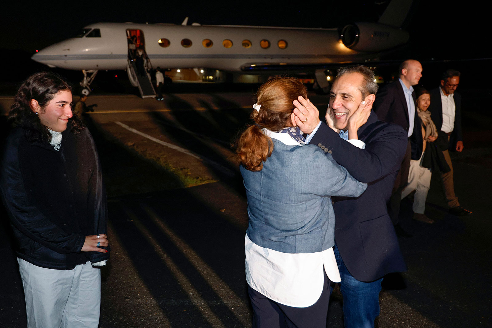 Emad Shargi embraces his wife after arriving at Fort Belvoir’s Davison Army Airfield on Tuesday morning.